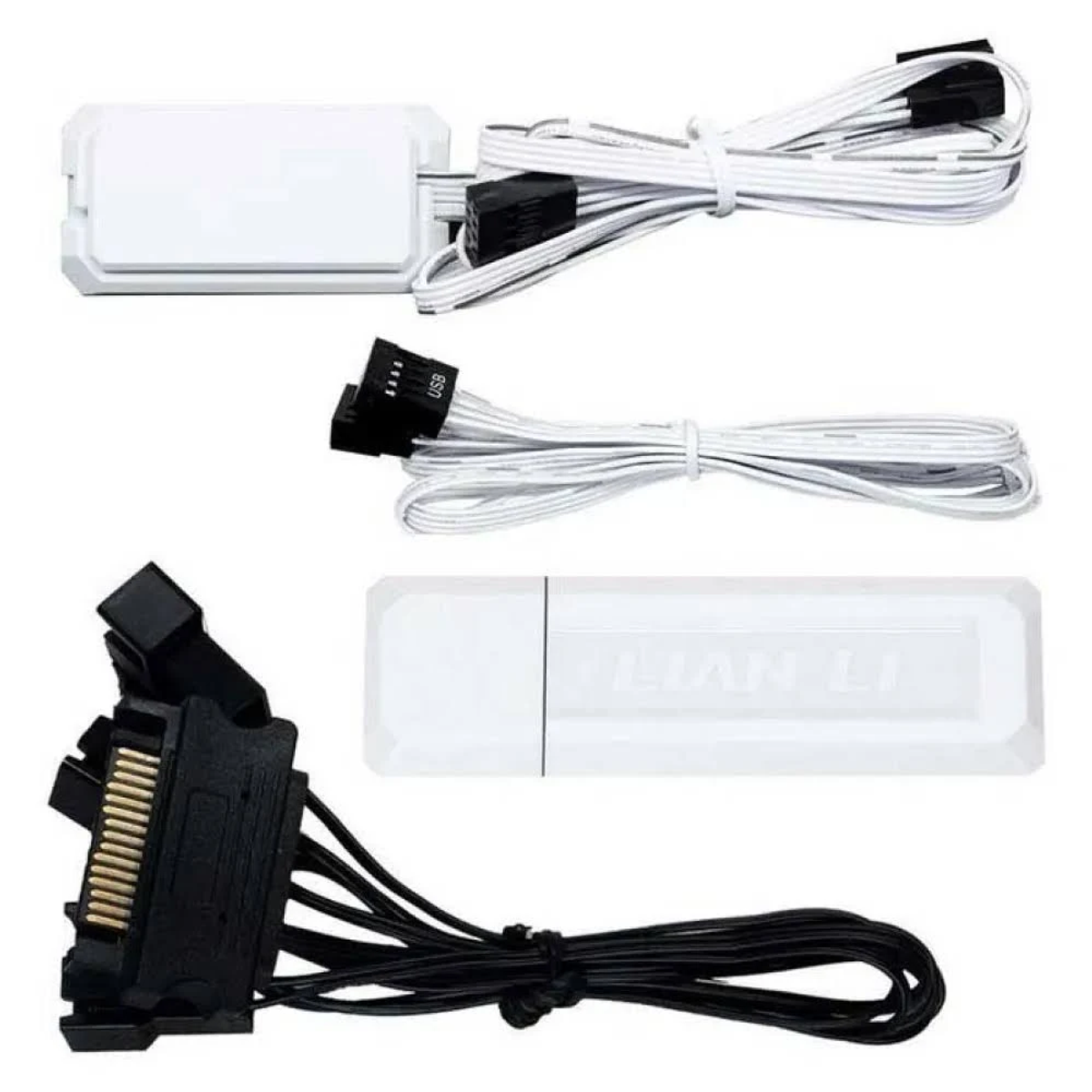 Image shows computer components: white control boxes, cables, and connectors. Black connectors and cables are also present.