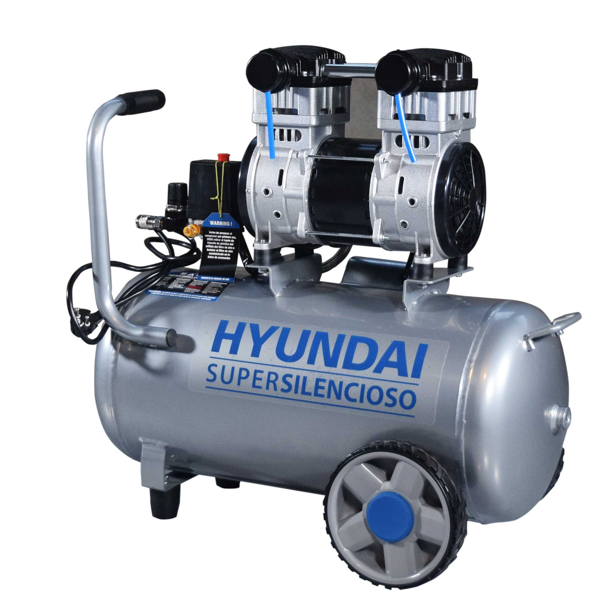 Un compresor de aire Hyundai plateado con partes negras, detalles azules y ruedas. Tiene asa y etiquetas de advertencia.