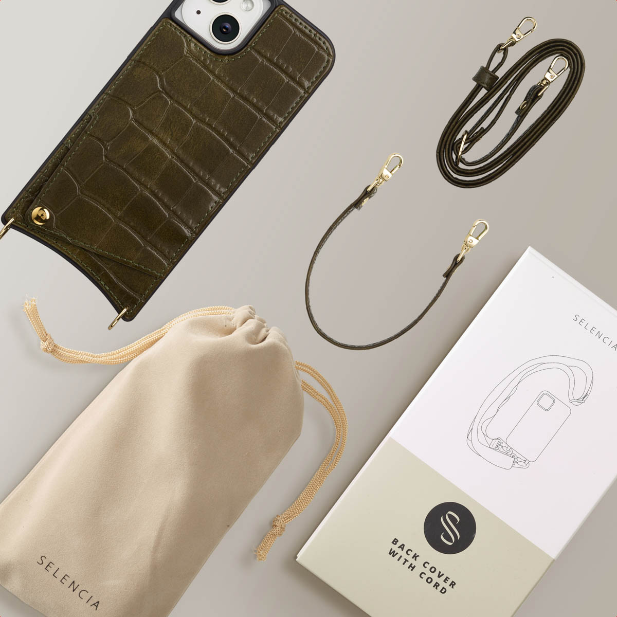 Olijfgroene telefoonhoes met riem en accessoires. Inclusief een zakje, lange en korte riemen en verpakking.