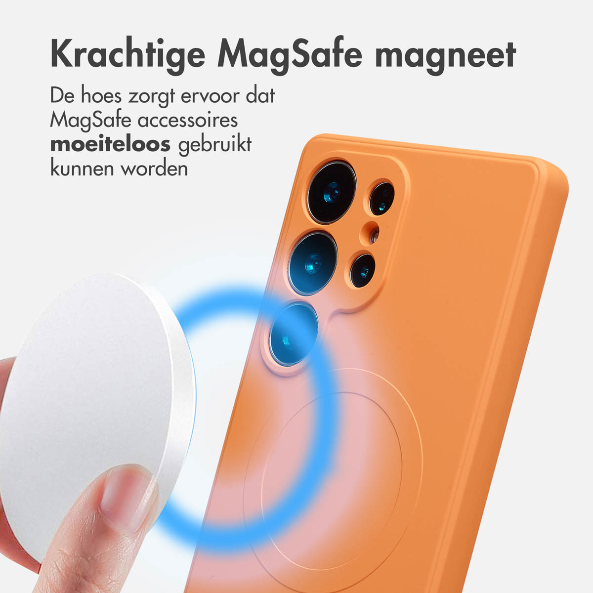 Een oranje telefoonhoesje met een cirkel, een witte schijf wordt erbij gehouden. Blauw magnetisch veldeffect zichtbaar.