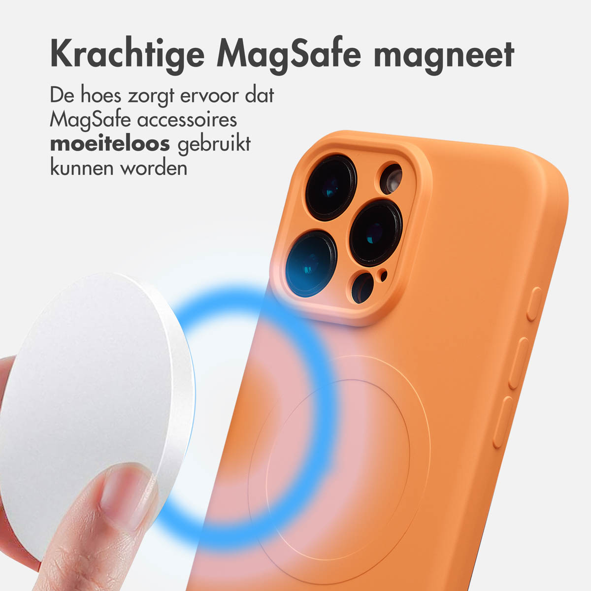 Een oranje telefoonhoesje met een cirkel. Een wit rond accessoire wordt dichtbij gehouden. Blauwe magnetische veldlijnen zijn zichtbaar.