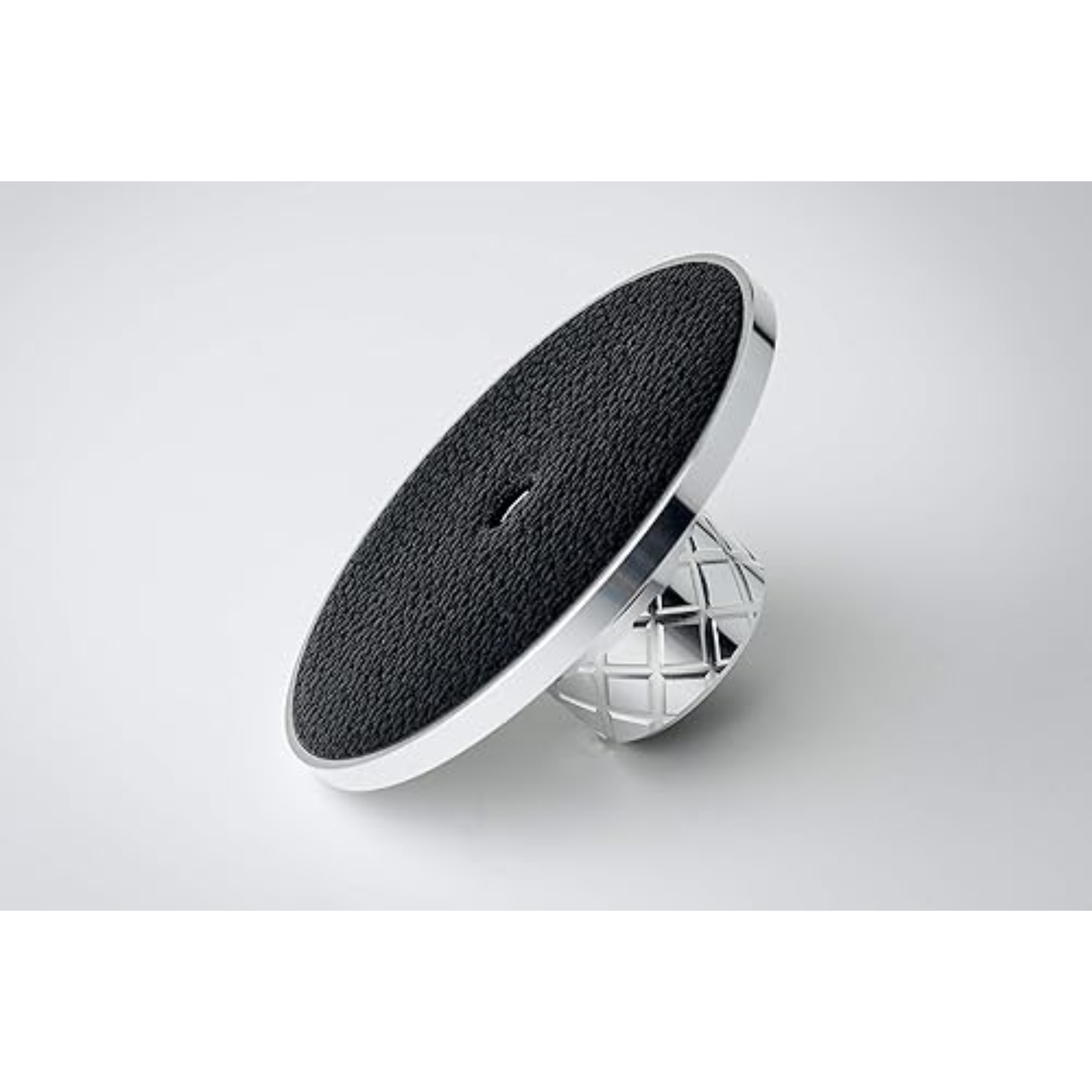 A turntable weight. It has a black textured top, a silver rim, and a diamond-patterned base.