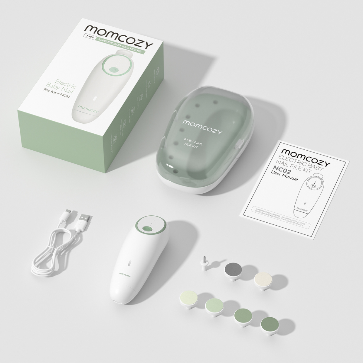 Un kit de lime à ongles pour bébé Momcozy blanc et vert. Comprend la lime, le câble de charge, l'étui, le manuel d'utilisation et divers accessoires.