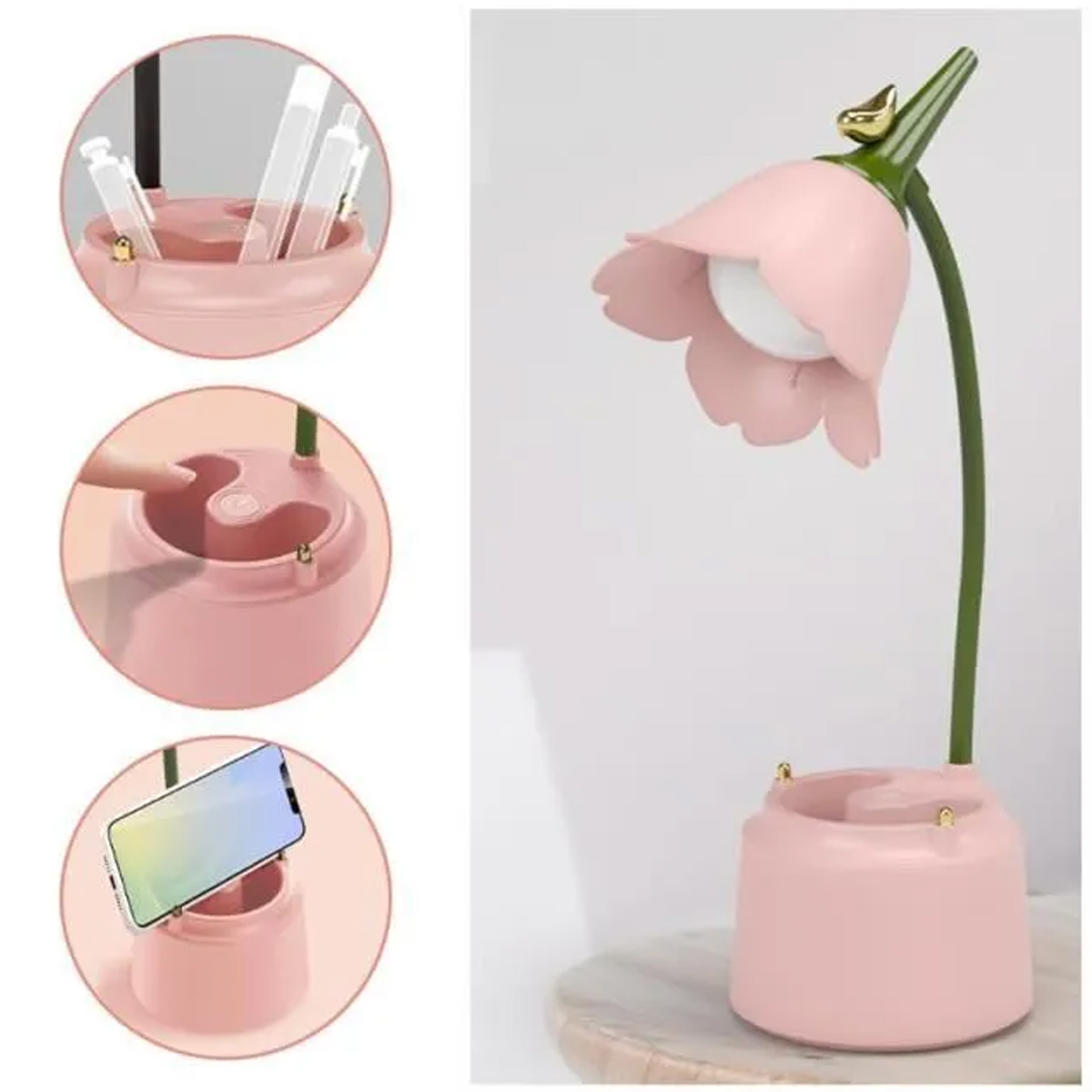 Eine rosa blütenförmige Schreibtischlampe mit einem Vogel oben, plus Handy- und Stifthalter, alles in Rosa.
