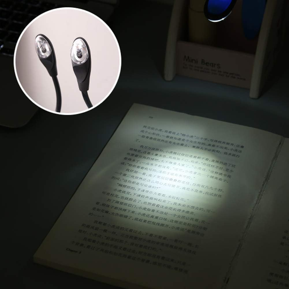 Zwei schwarze LED-Schwanenhals-Buchlampen beleuchten ein offenes Buch. Der Hintergrund umfasst einen kleinen Behälter.