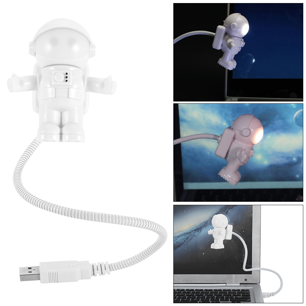 Eine weiße USB-Lampe in Form eines Astronauten mit flexiblem Hals und USB-Anschluss. Der Astronaut befindet sich in der Nähe eines Laptops.