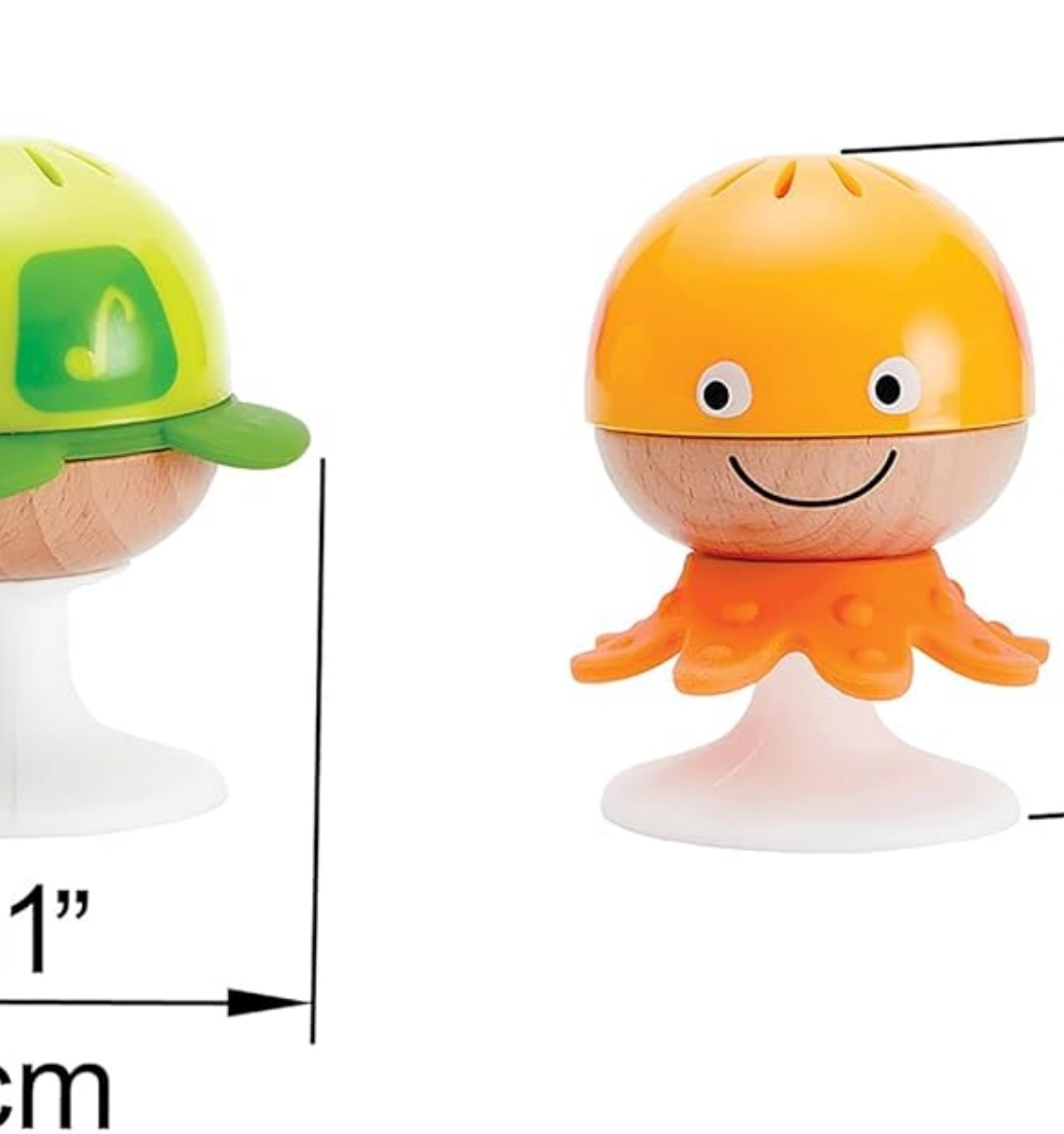 Zwei Spielfiguren: ein orangefarbener, lächelnder Oktopus und eine grüne Schildkröte. Beide sitzen auf weißen Sockeln. Der Oktopus wird mit 1 Zoll gemessen.