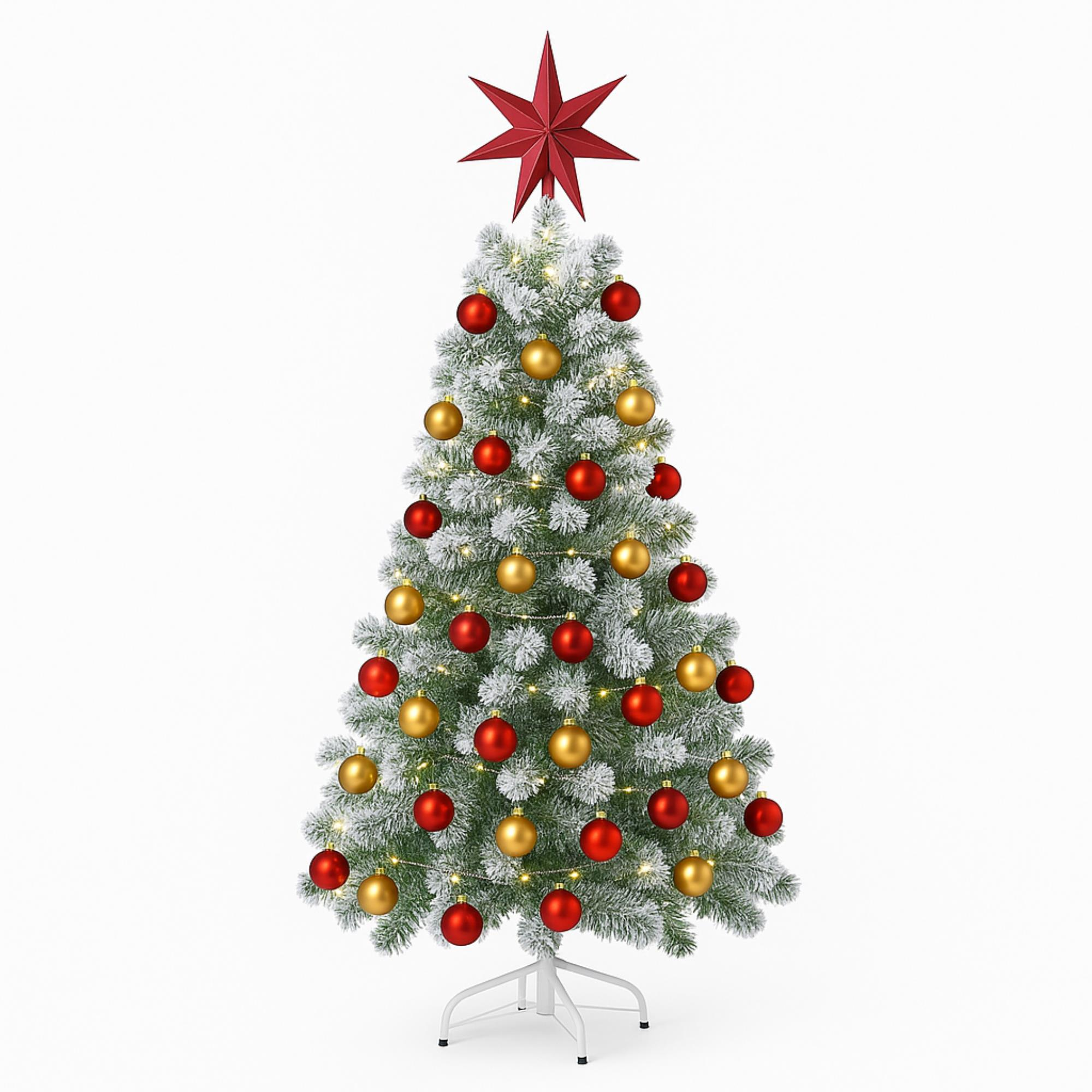 Un árbol de Navidad decorado con adornos rojos y dorados, una estrella roja encima y un soporte blanco.