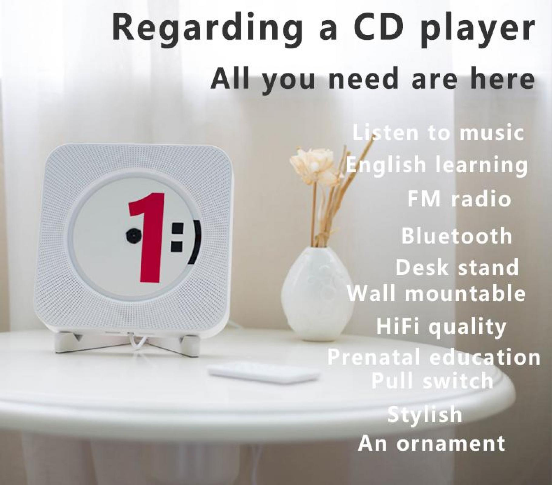 Ein weißer CD-Player mit einer roten 1, eine Vase mit Blumen und eine Fernbedienung auf einem weißen Tisch.