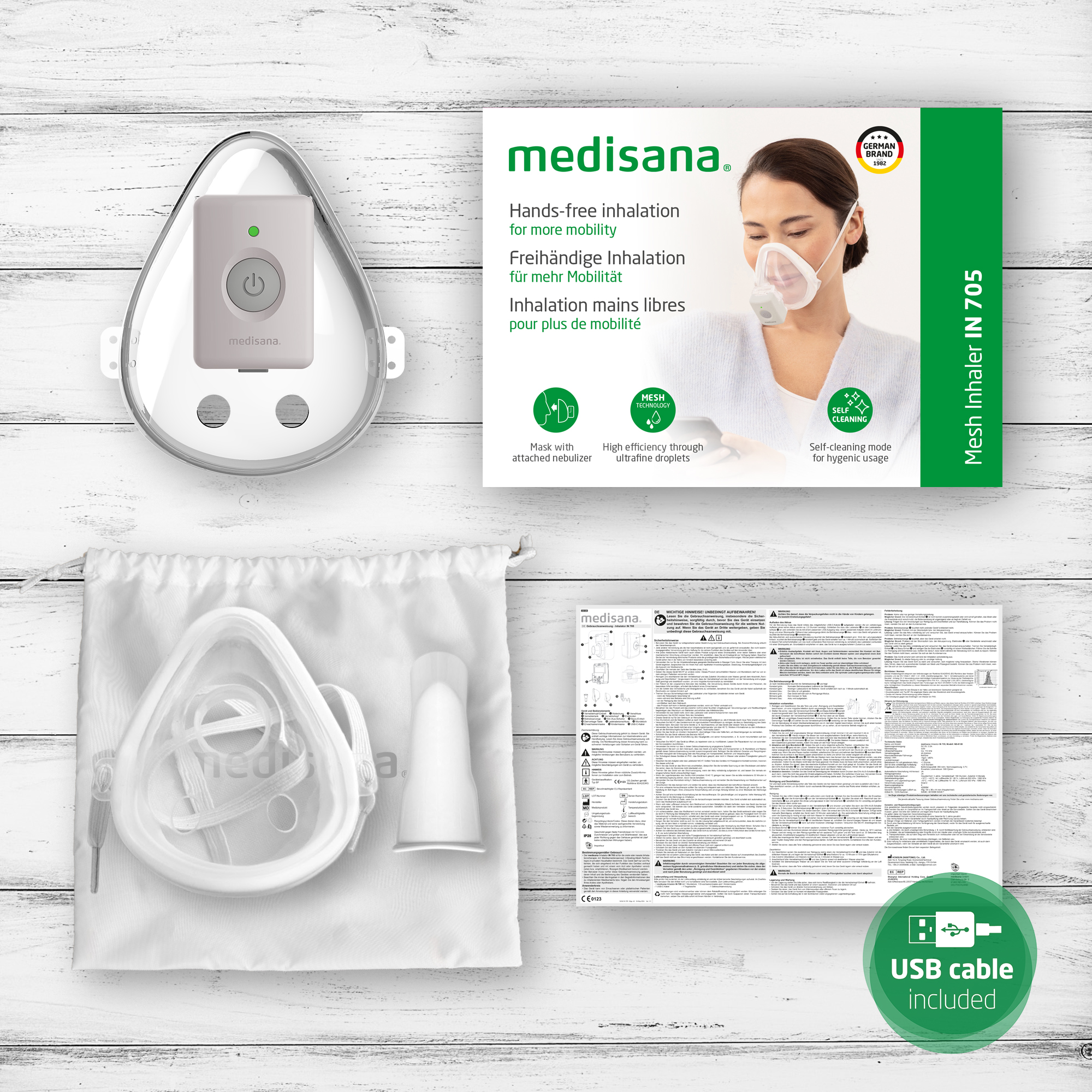 A white medisana inhaler with a mask, USB cable, and instructions. The packaging includes a woman using the inhaler.