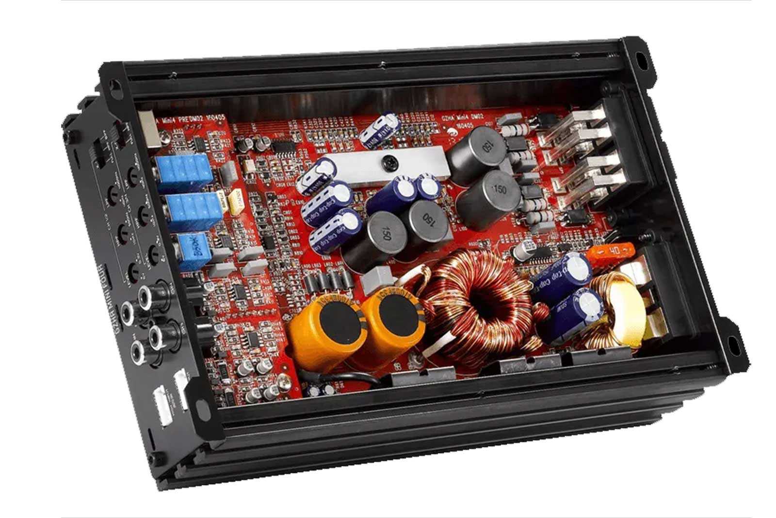 Eine elektronische Leiterplatte mit verschiedenen Komponenten, darunter Kondensatoren, Widerstände und Spulen, in einem schwarzen Metallgehäuse.