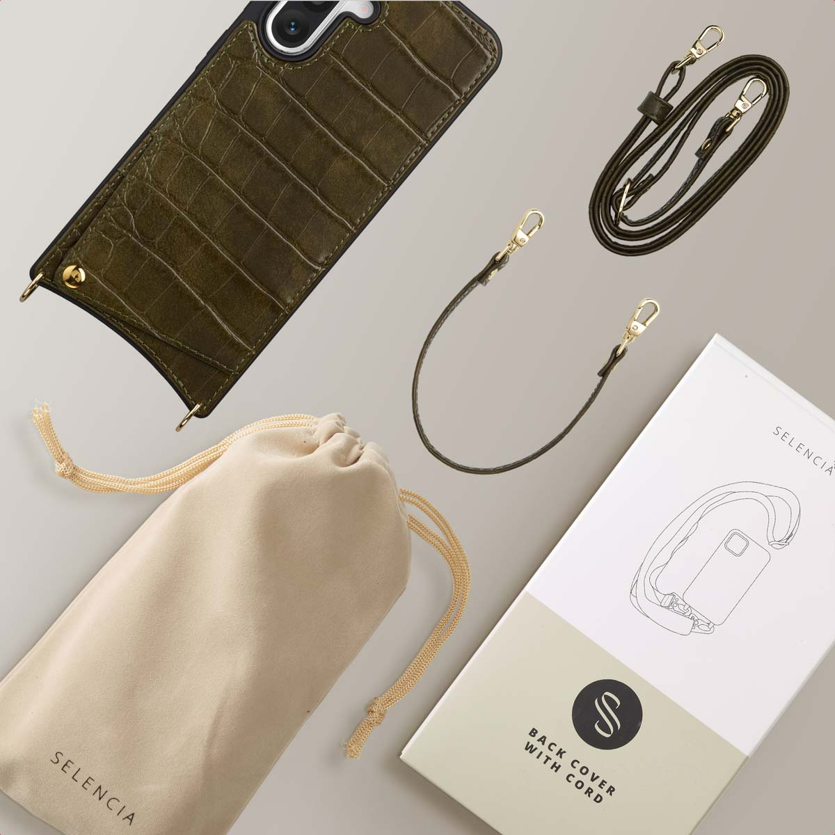 Coque de téléphone vert olive avec sangle et sac. Le paquet comprend cordon, crochets et un schéma de la coque.