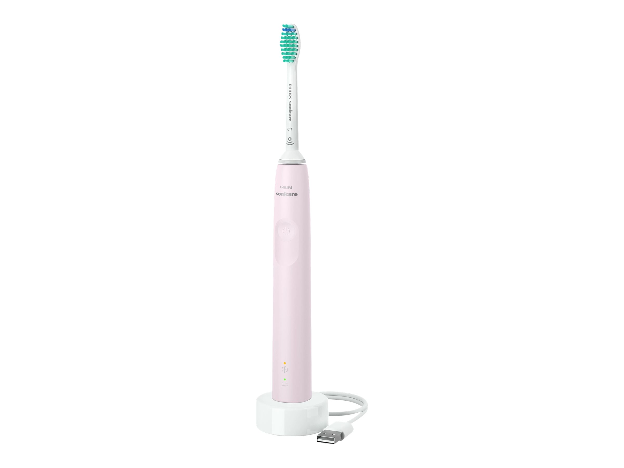 Różowa szczoteczka do zębów Philips Sonicare stoi na białej stacji ładującej. Szczoteczka jest biało-zielona. Podłączony jest kabel USB.