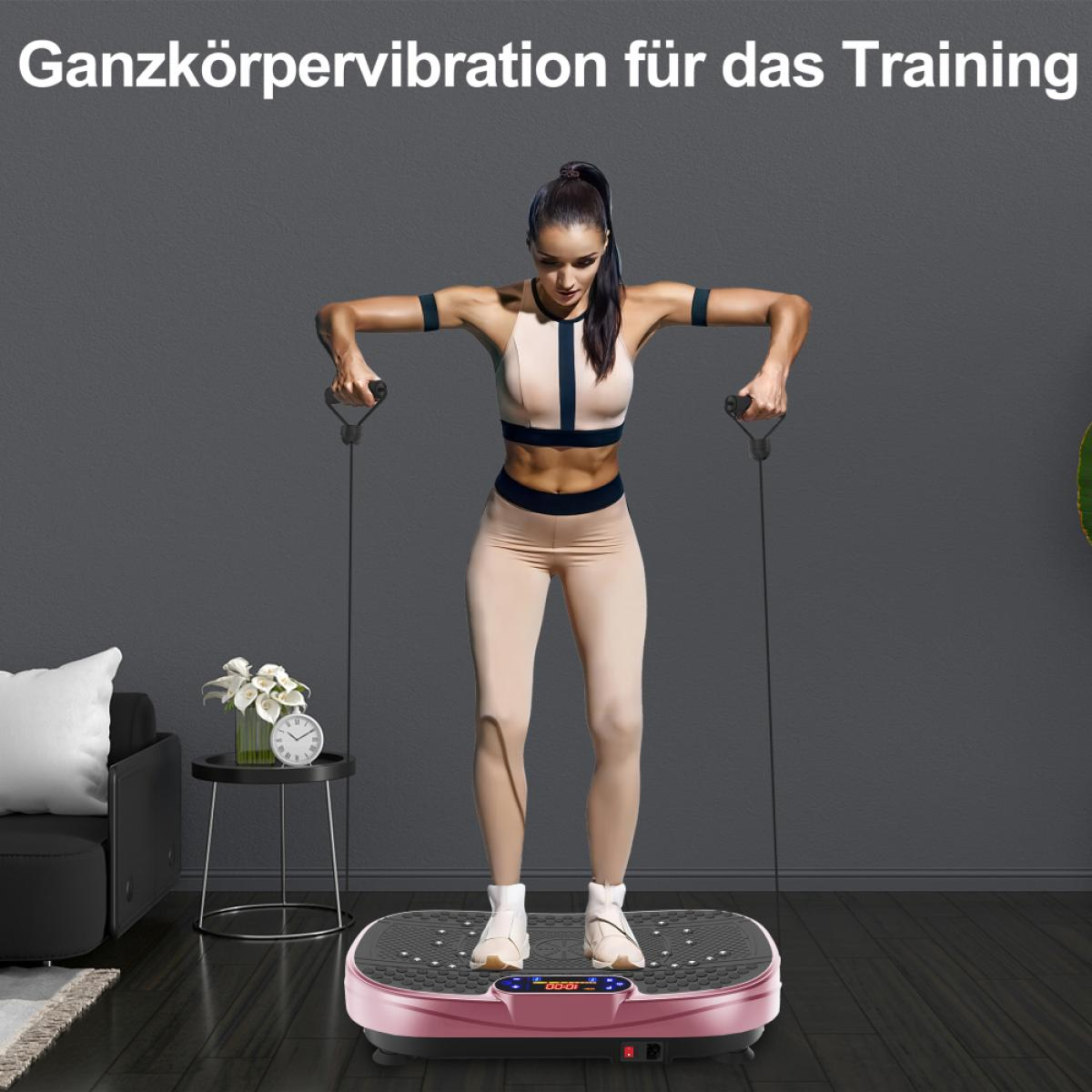 Eine Frau trainiert auf einer rosa Vibrationsplatte und hält Griffe. Sie trägt ein Fitness-Outfit. Hintergrund mit Sofa, Tisch mit Blumen und Uhr.