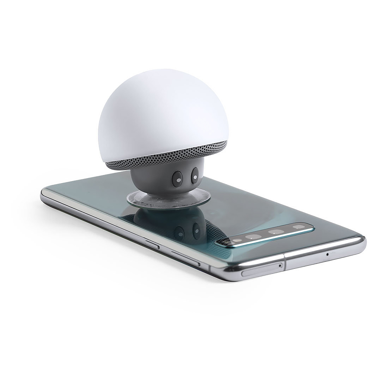 Un altoparlante bianco a forma di fungo è posizionato su uno smartphone. Il telefono è argentato con uno schermo blu-verde. L'altoparlante ha una griglia a rete.