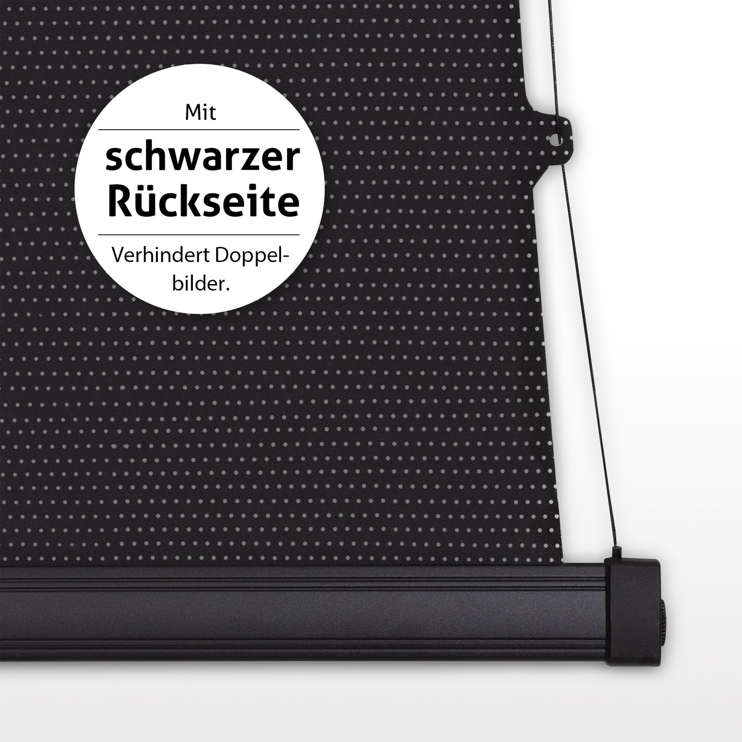 Nahaufnahme einer schwarzen Rollo mit weißen Punkten. Ein weißer Kreis besagt: mit schwarzer Rückseite, verhindert Doppelbilder.