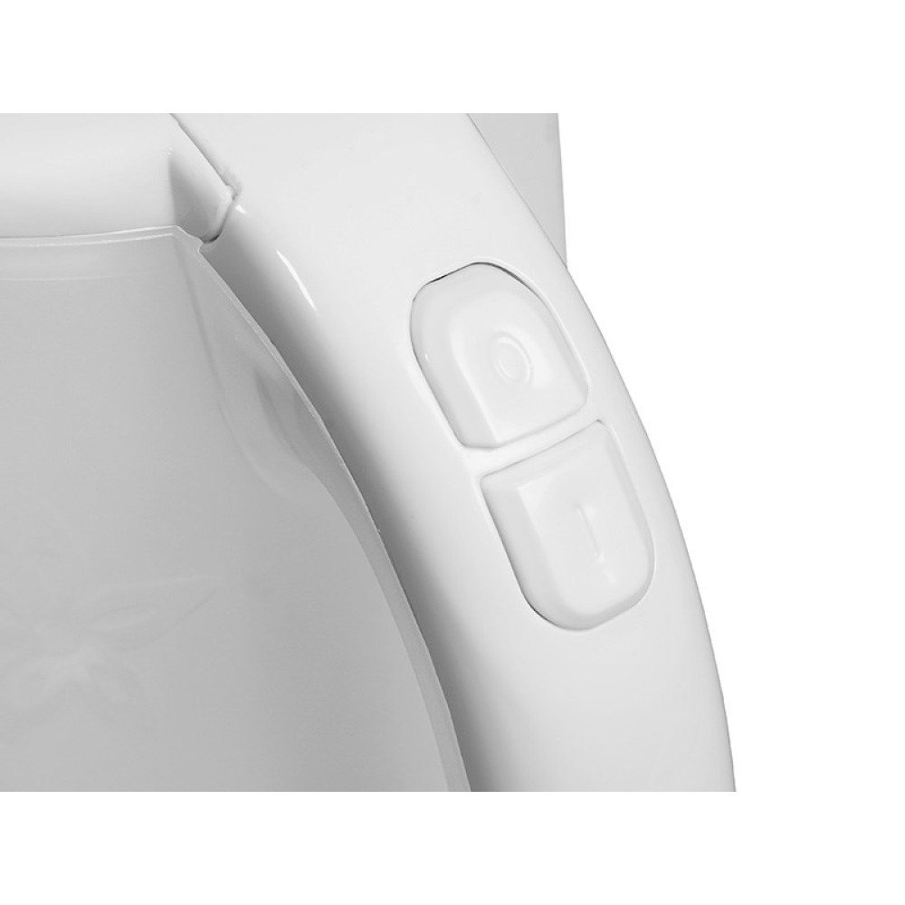 Zbliżenie białego plastikowego przedmiotu, prawdopodobnie części urządzenia, z dwoma przyciskami.