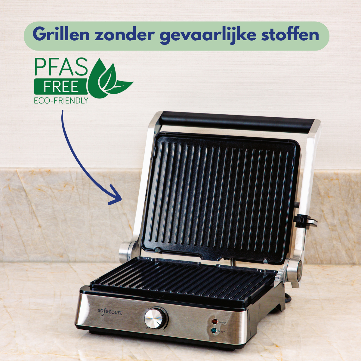Open grill with black grates on a marble counter. Text says PFAS free. The grill is silver with a knob and power indicator lights.