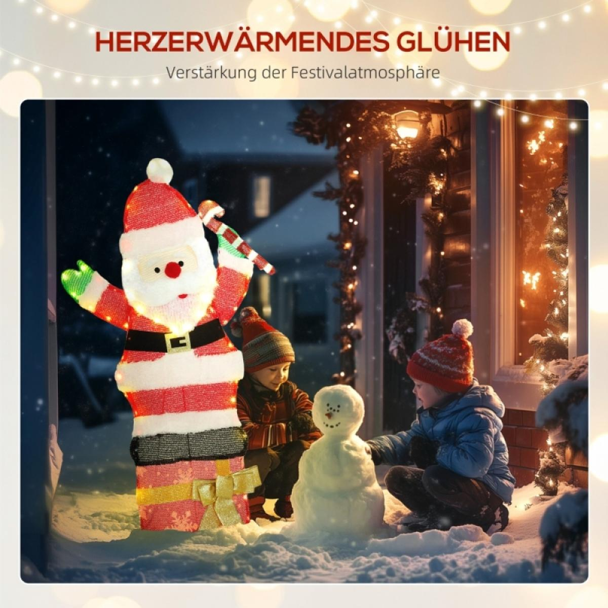 Kinder bauen einen Schneemann neben einer leuchtenden Santa-Dekoration. Die Szene spielt im Winter mit Schnee und festlichen Lichtern.
