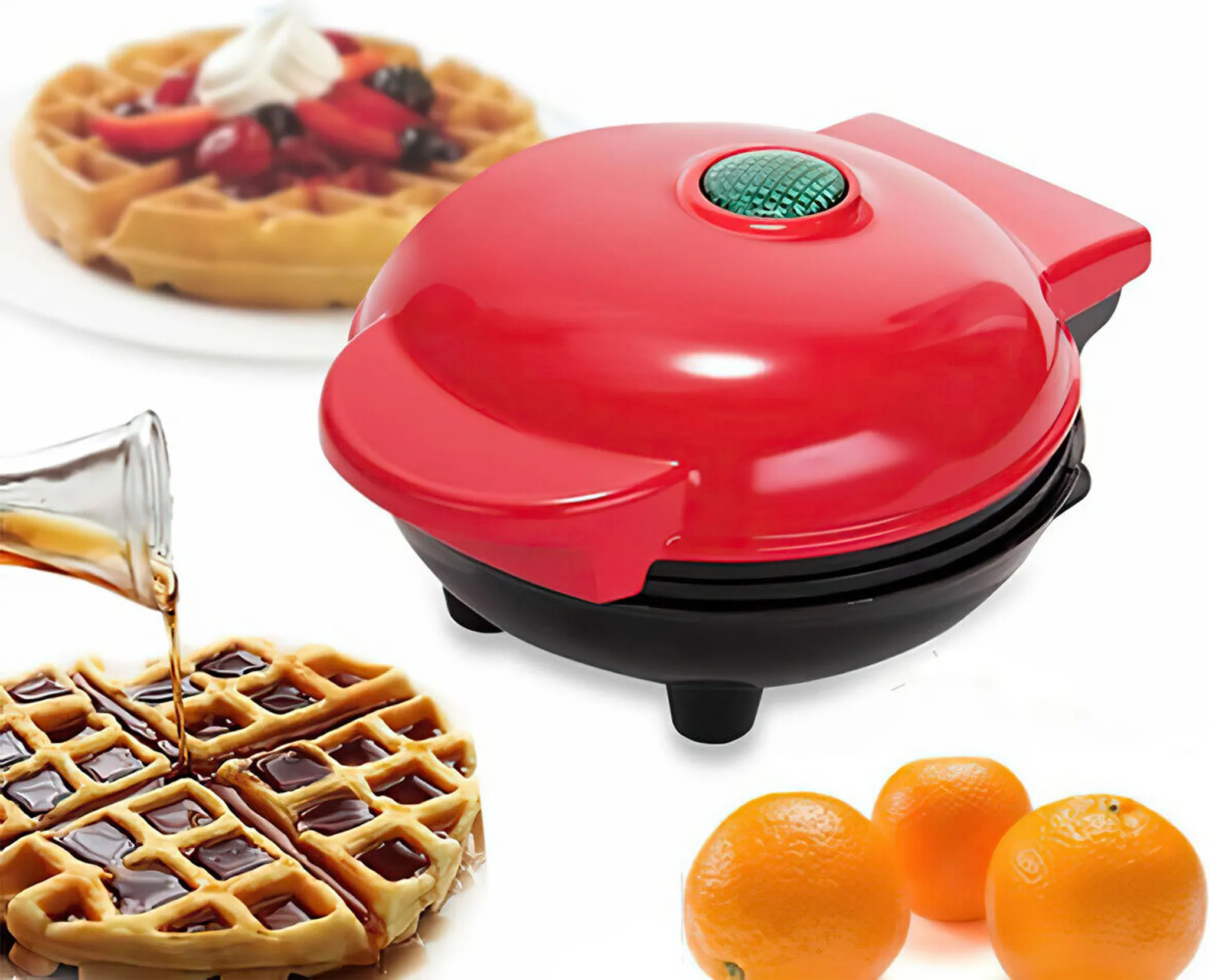 Ein roter Waffeleisen, Waffeln mit Sirup und Belägen sowie Orangen sind abgebildet.
