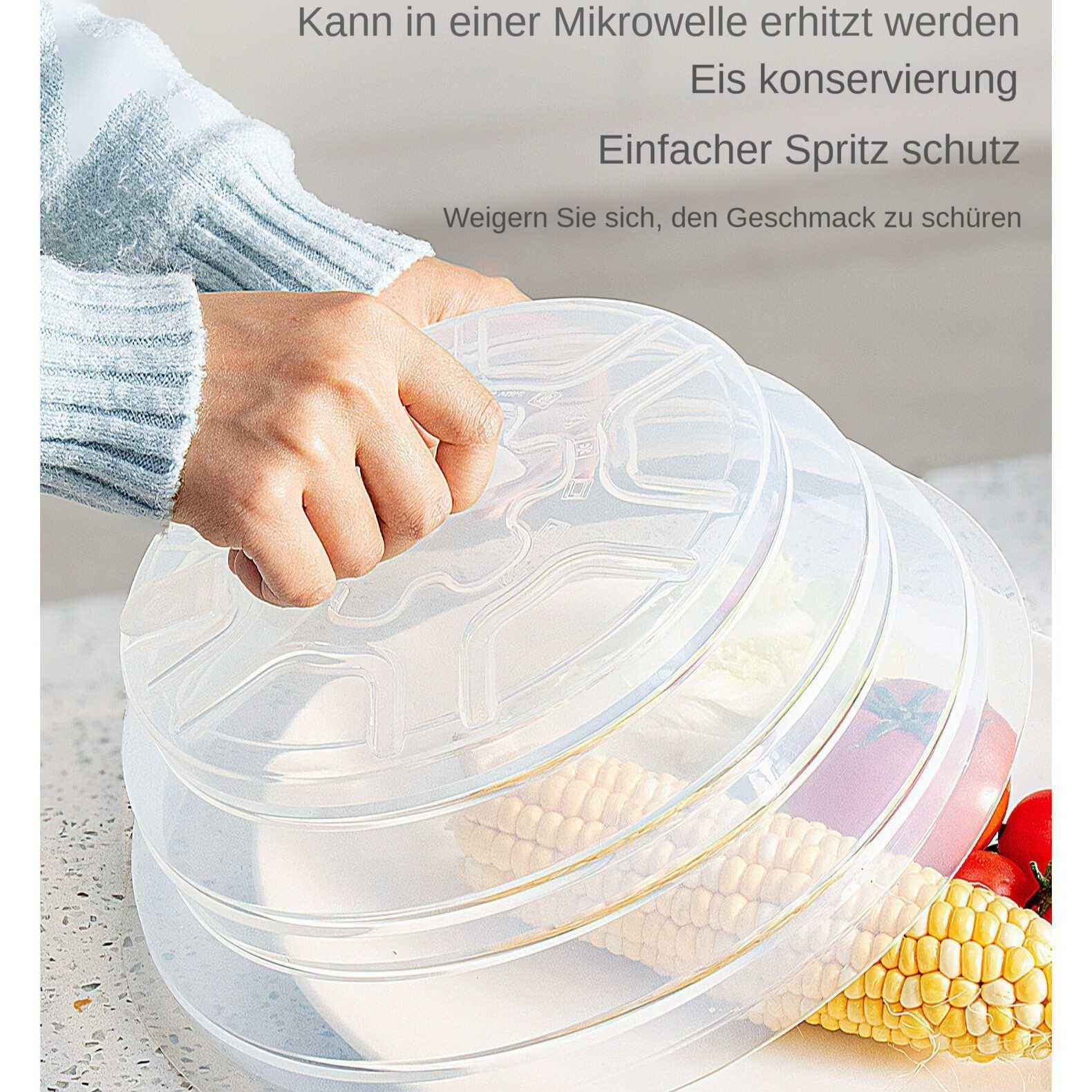Hände halten transparente Deckel über Lebensmitteln wie Mais und Tomaten.