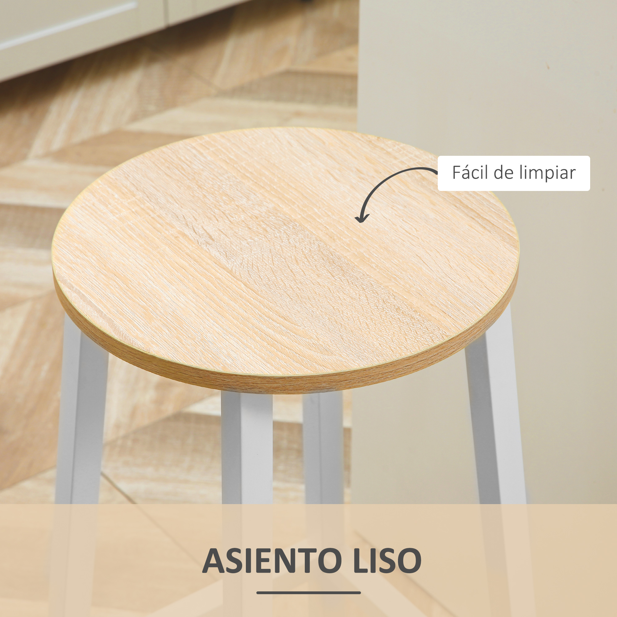 Un taburete redondo de madera con patas blancas. El asiento es marrón claro y el suelo tiene un patrón de madera. Fácil de limpiar.