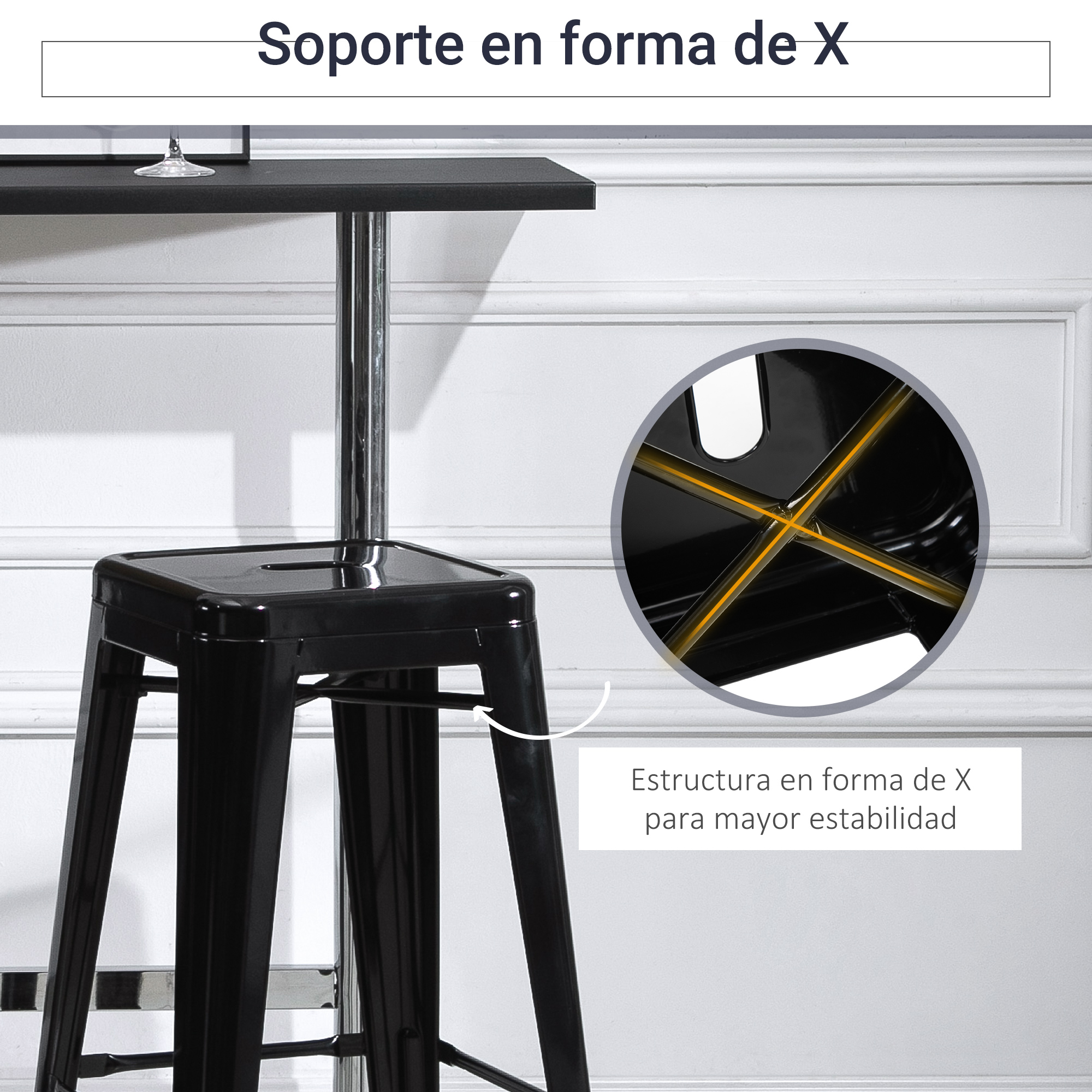Un taburete de bar negro con soporte en forma de X para estabilidad. Tiene asiento y patas negras. En el fondo, una pared blanca.
