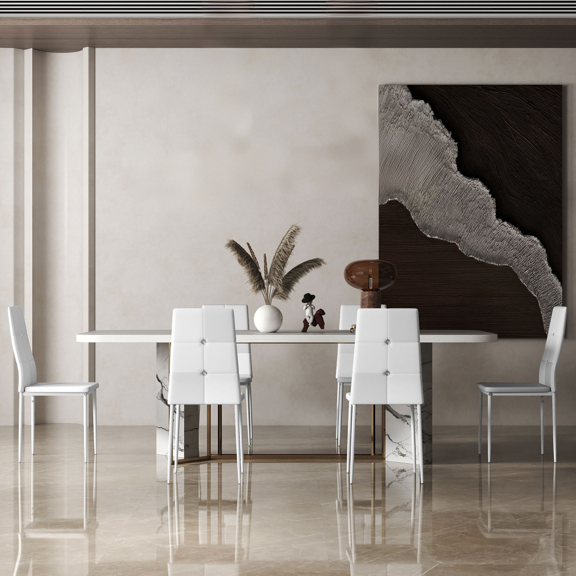 Un comedor con mesa, sillas, arte y decoración. El suelo es brillante. Sillas blancas rodean la mesa.