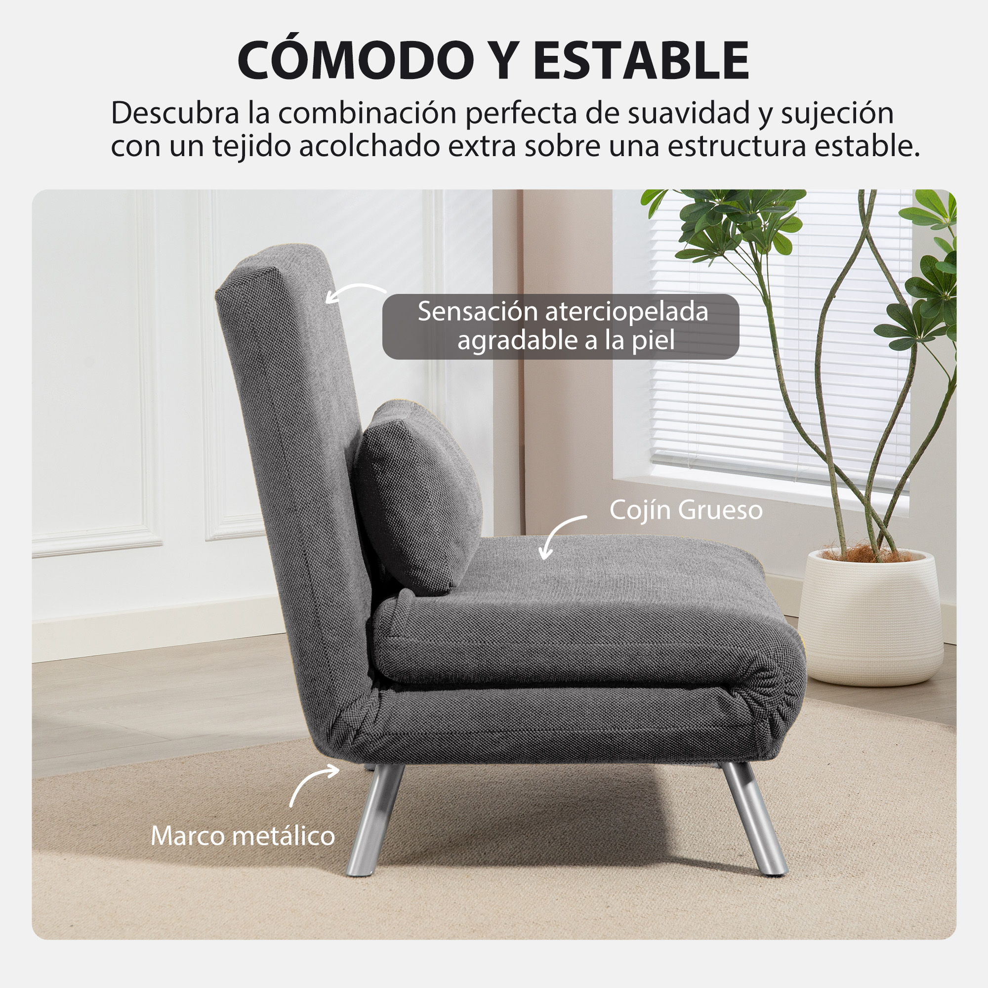 Sillón gris con patas metálicas. Cojín grueso y almohada pequeña. Planta en maceta blanca al fondo.