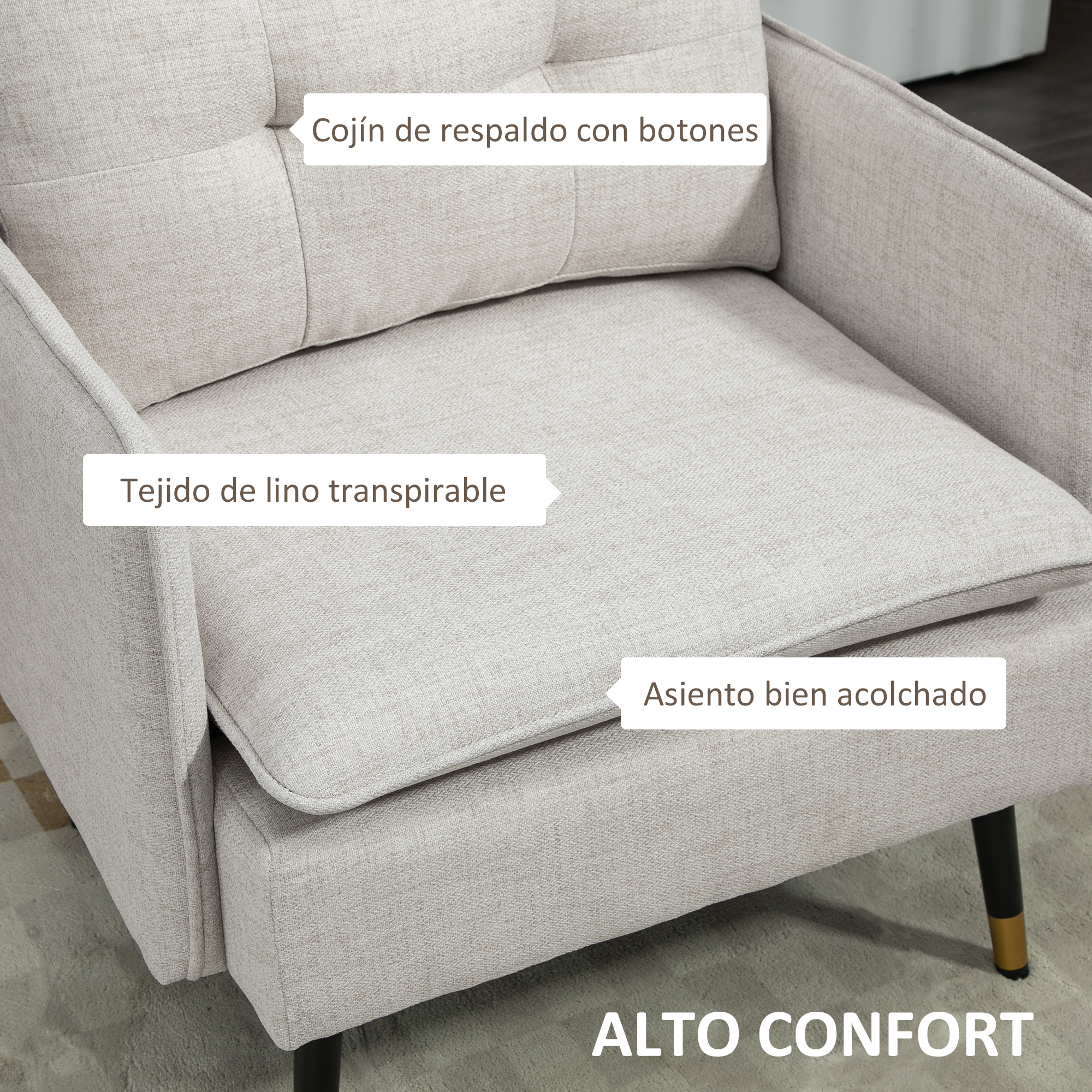 Sillón tapizado beige. Cuenta con respaldo con botones, tejido de lino transpirable y asiento acolchado. Patas negras con puntas doradas.