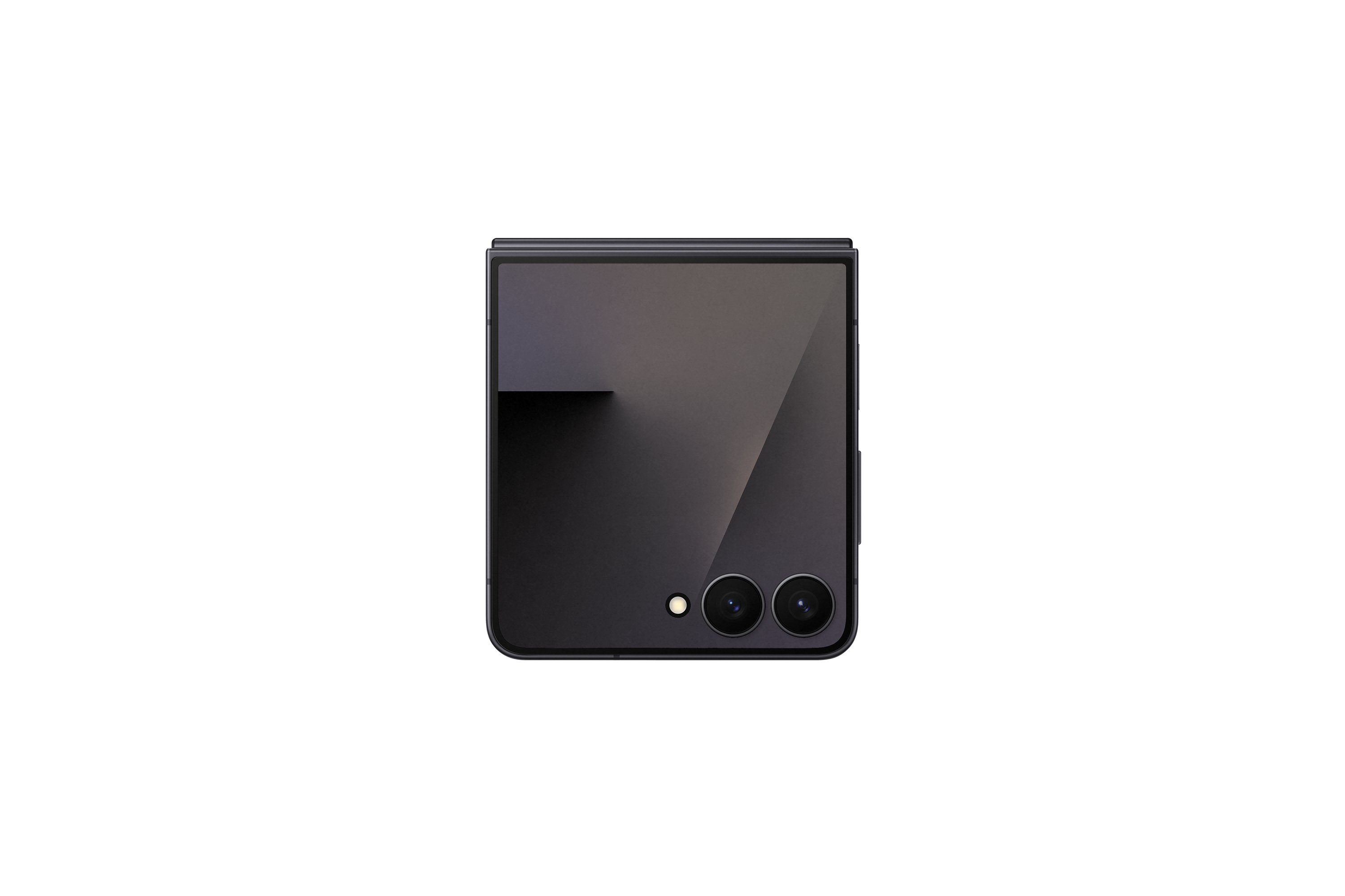 Składany smartfon na czarnym tle. Telefon jest szary, złożony, z dwoma aparatami i lampą błyskową. Czarne tło.