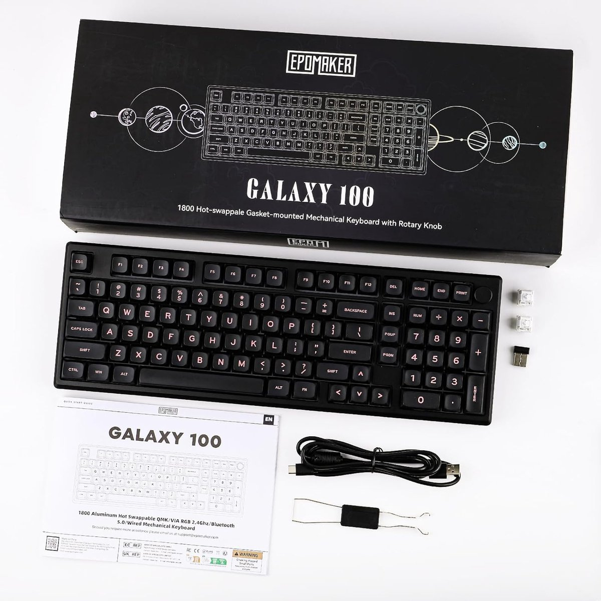 Black Epomaker Galaxy 100 keyboard. Box, manual, and accessories are visible. Keyboard with white keys and labels.