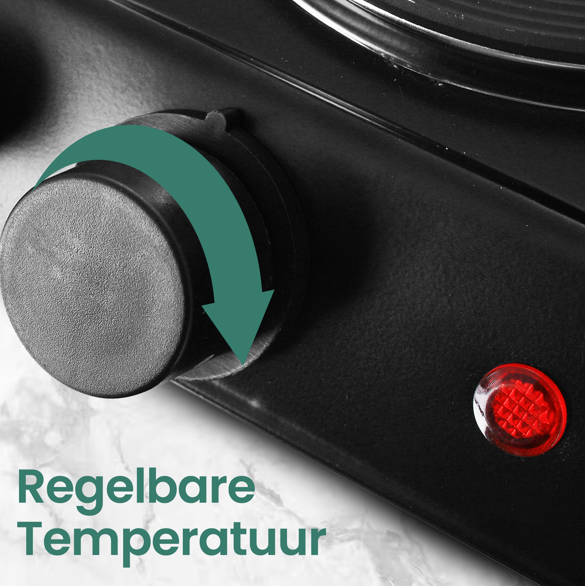 Close-up of a black stove with a dial and a red light. A green arrow indicates temperature adjustment.