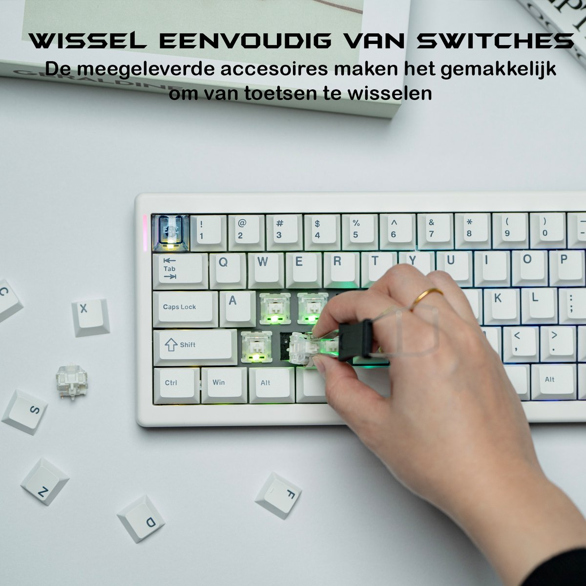 A hand replacing a key switch on a white keyboard. Several loose keycaps lie around. The scene is brightly lit.