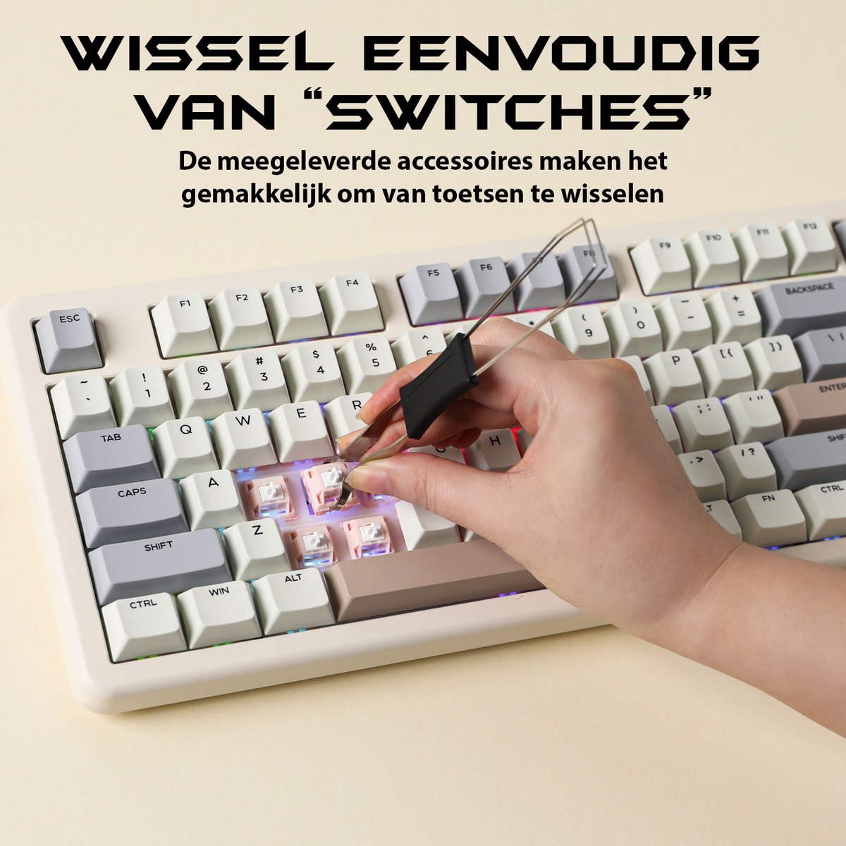 A hand using a tool to remove a key from a keyboard. The keyboard is white with black keys and colorful lights.