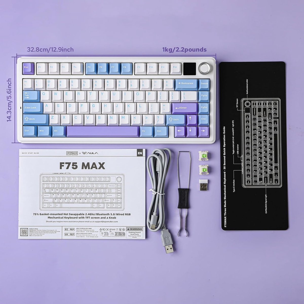 Een toetsenbord met een TFT-scherm, een knop en accessoires worden getoond op een paars oppervlak.