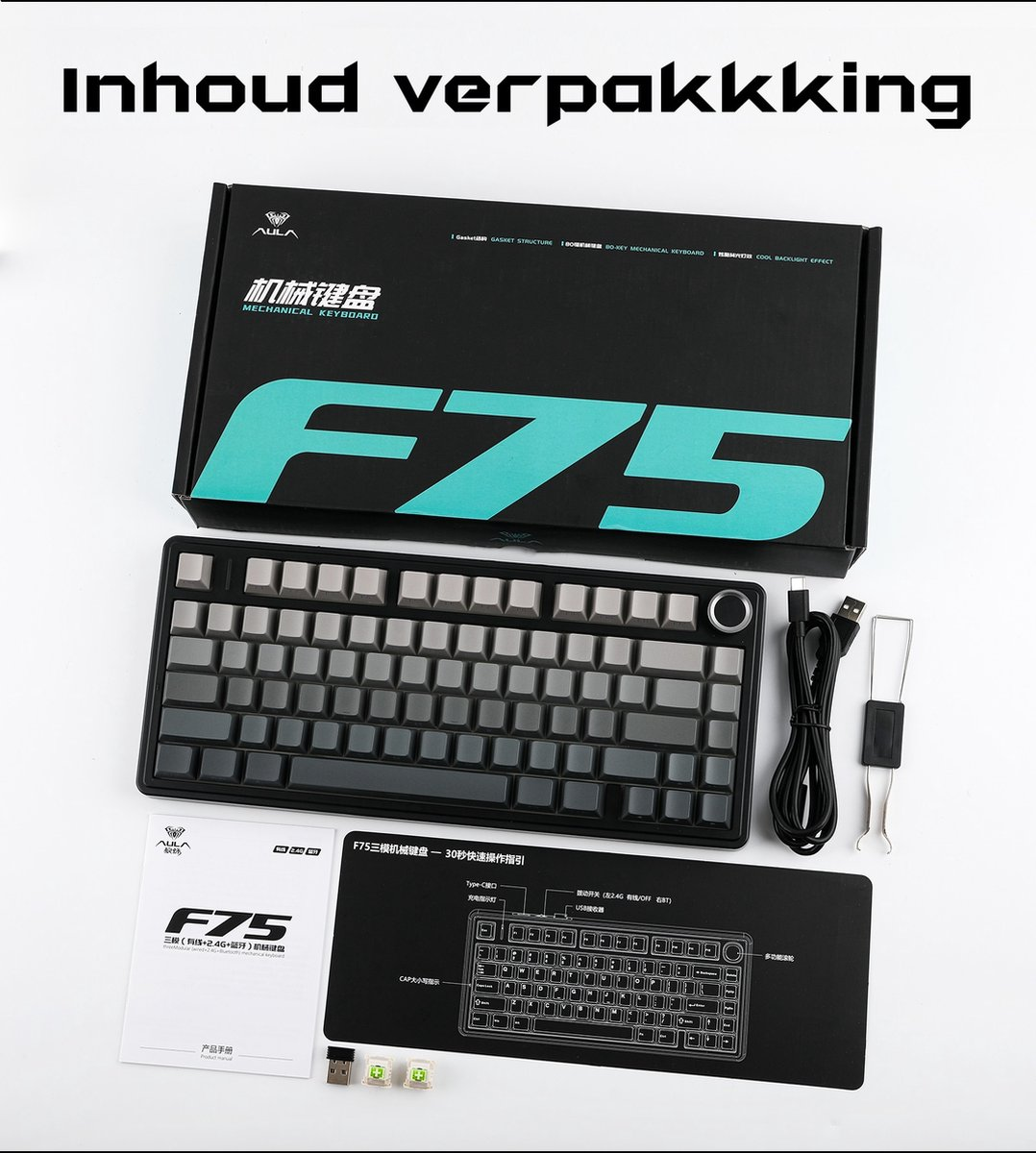 Eine Tastaturbox mit Tastatur, Kabel und Zubehör. Die Tastatur ist schwarz und grau, mit einer Diagramm auf einer schwarzen Matte.