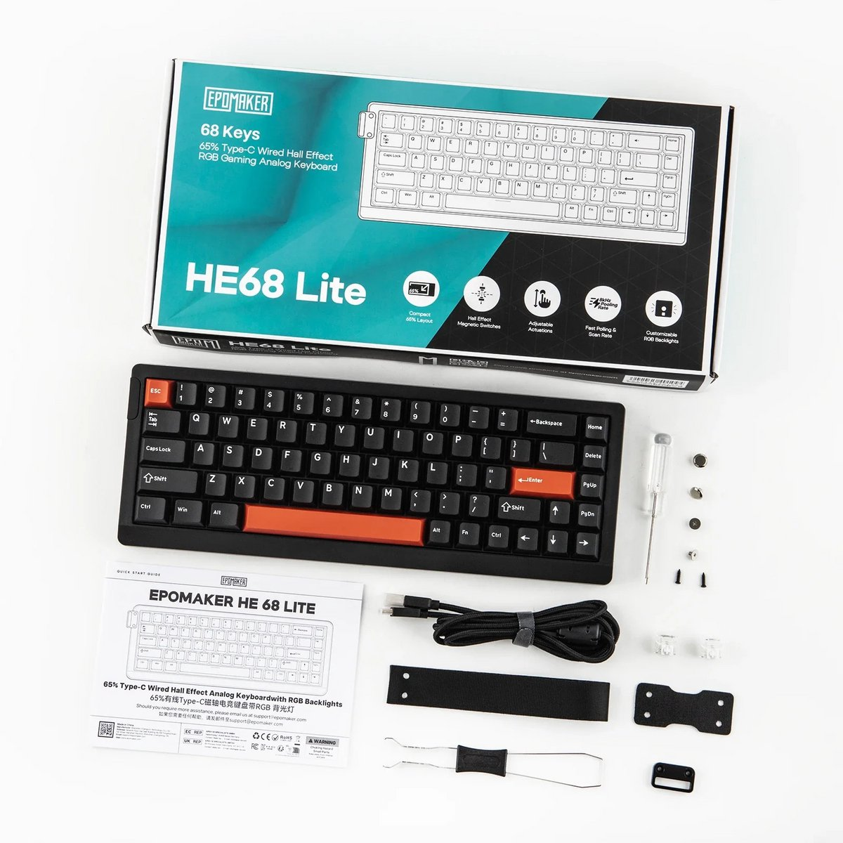 A keyboard and its components are laid out on a white surface. The keyboard is black, with orange accent keys.
