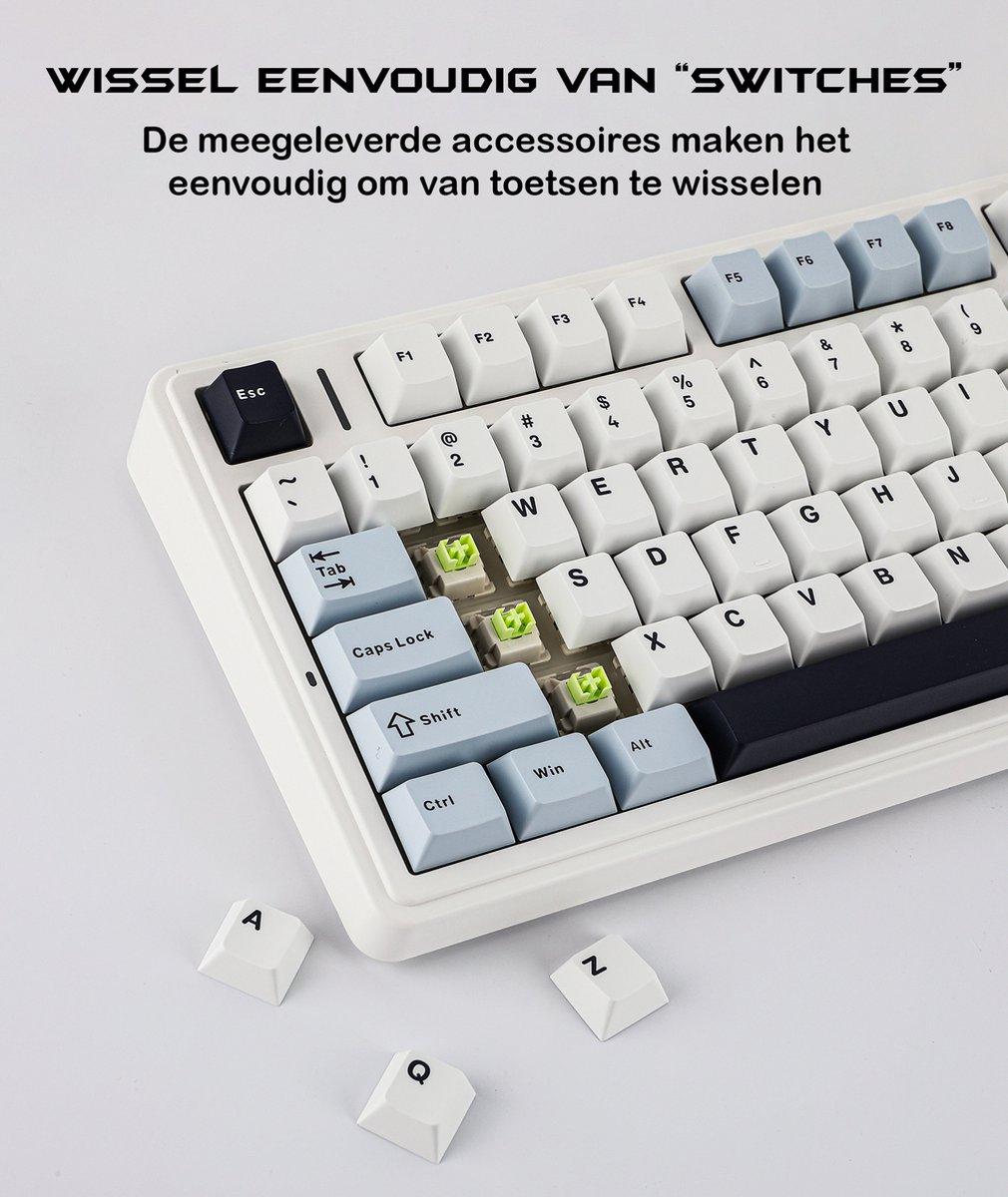 Eine weiße Tastatur mit hellblauen und weißen Tasten. Einige Tasten sind entfernt und zeigen grüne Schalter. Text 'SWITCHES'.