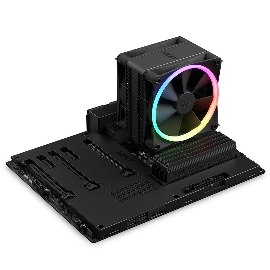 Una scheda madre per computer nera con un dissipatore CPU. Il dissipatore ha una ventola con luci arcobaleno. Il marchio NZXT è visibile.