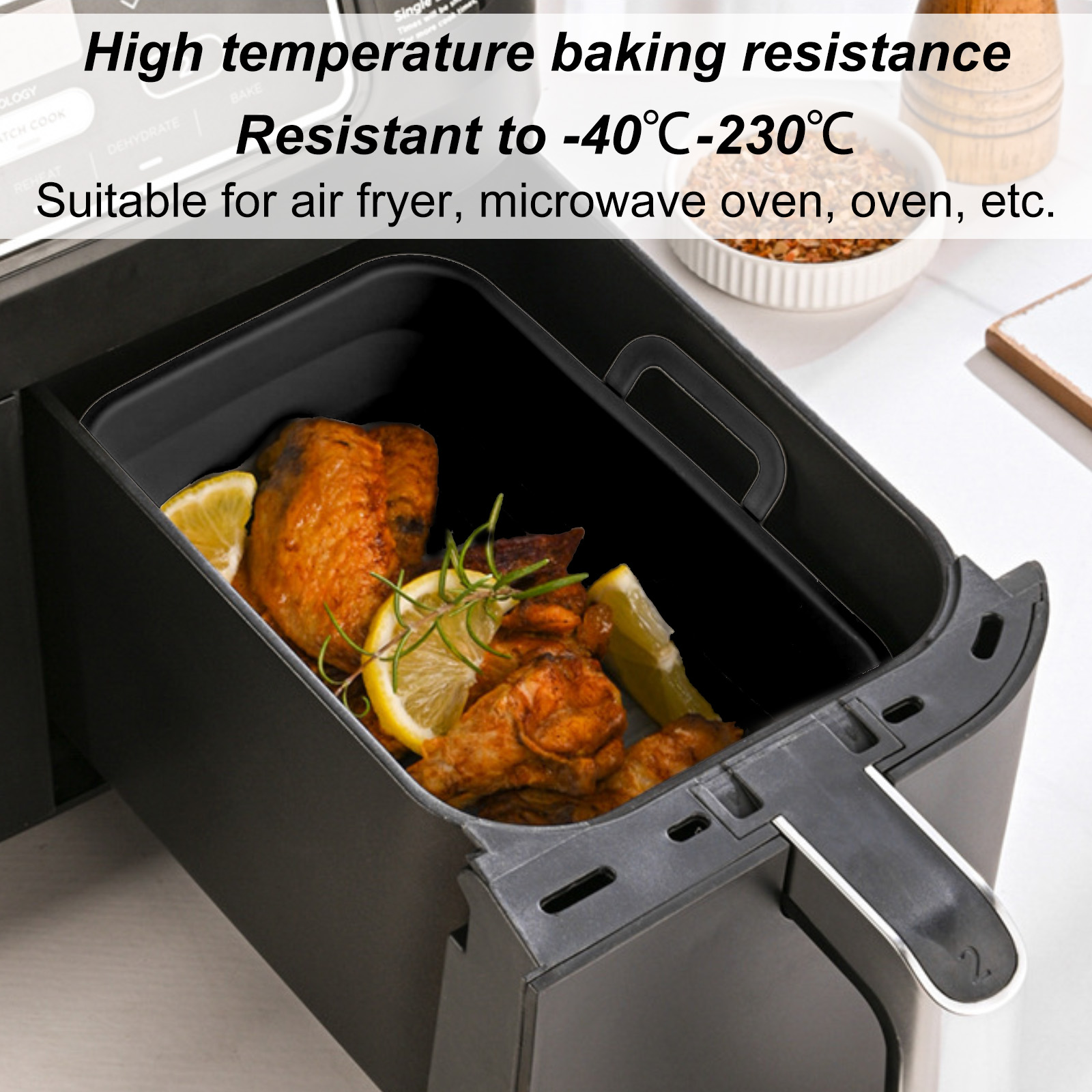 Ein Airfryer mit Hähnchen und Zitronenscheiben. Text oben besagt hohe Temperaturbeständigkeit.