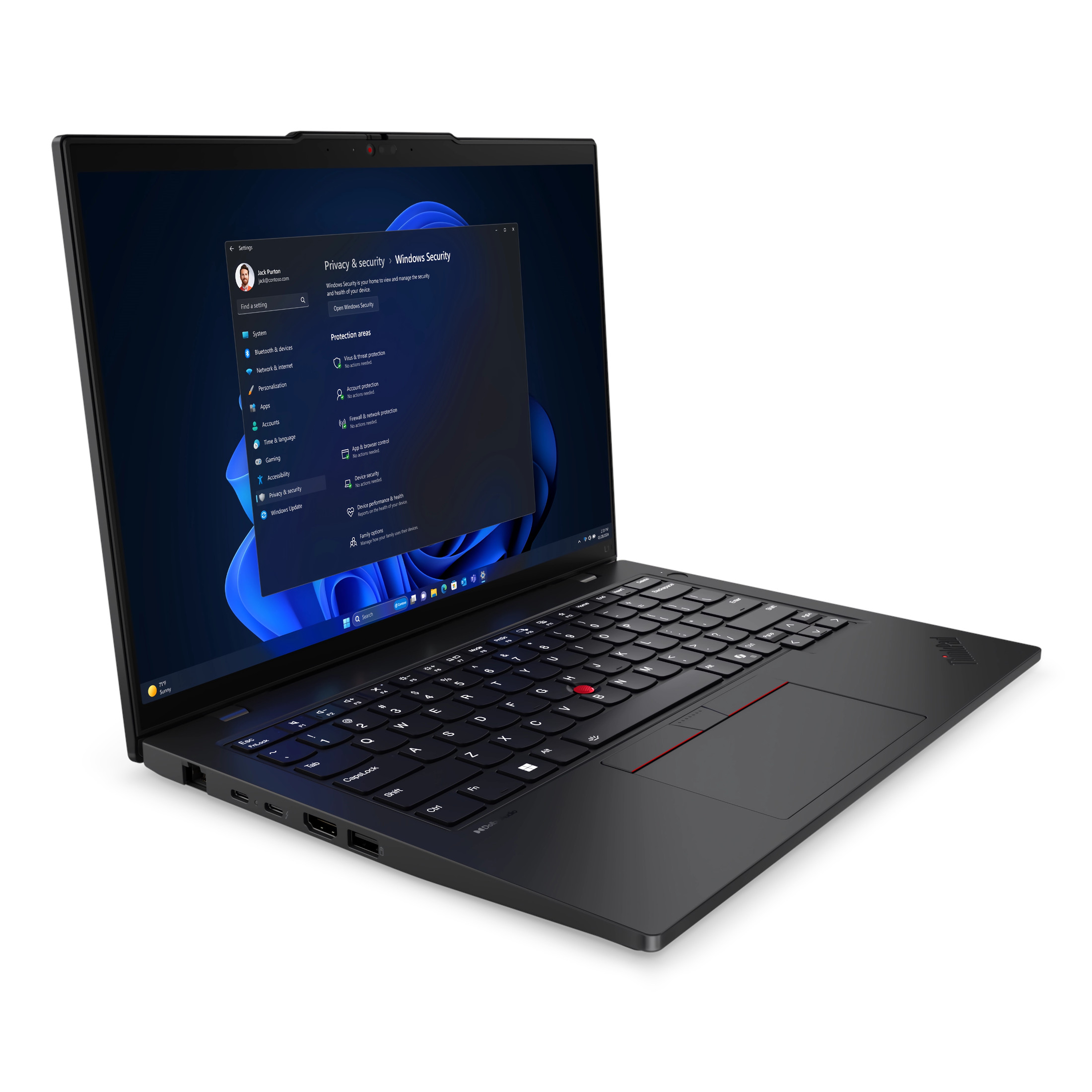 Ein schwarzer Laptop zeigt Windows Security an. Die Tastatur ist sichtbar mit einem roten Trackpoint. Der Bildschirm zeigt Einstellungen.