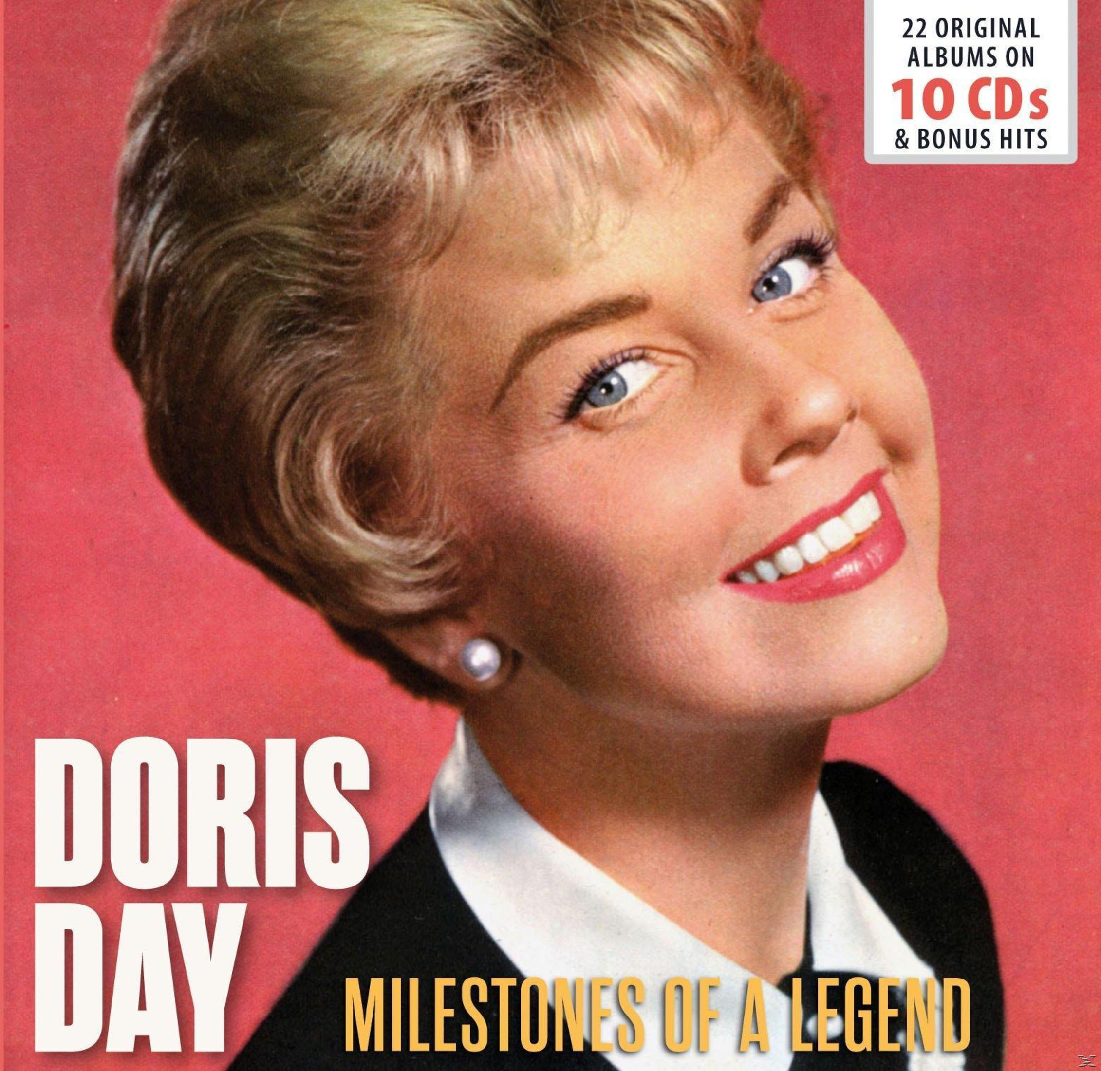 Albumhoes van Doris Day. Ze lacht met blauwe ogen, draagt een parel oorbellen. Tekst: 'Milestones of a Legend'.