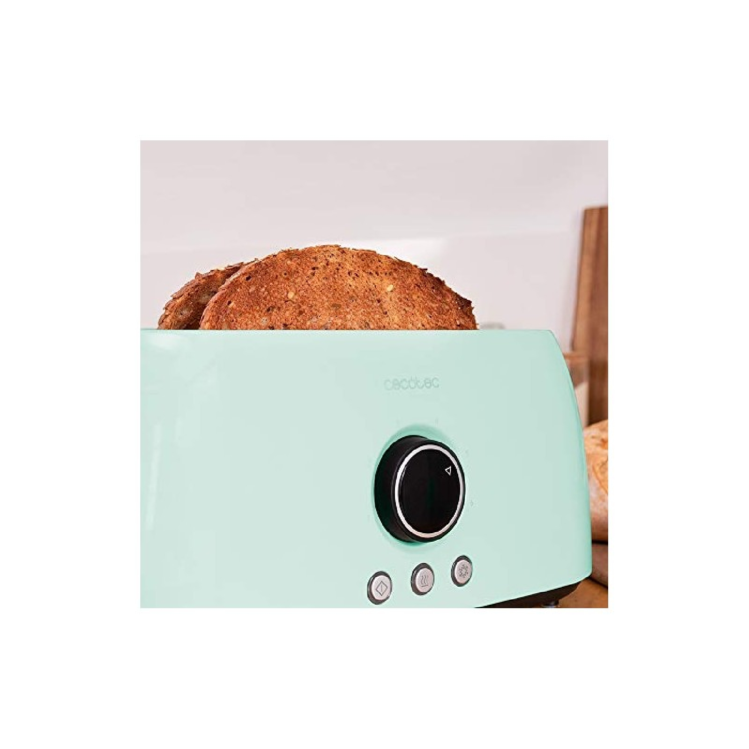 Un tostapane verde menta con due fette di pane tostato. Ha una manopola nera e tre pulsanti. Il marchio è visibile.