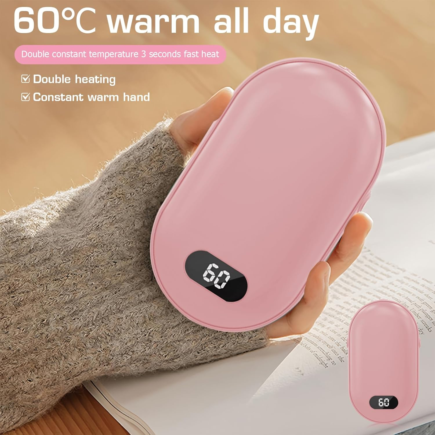 Ein rosa Handwärmer mit Digitalanzeige, die 60 anzeigt, wird gehalten. Text enthält '60°C warm den ganzen Tag' und Merkmale.