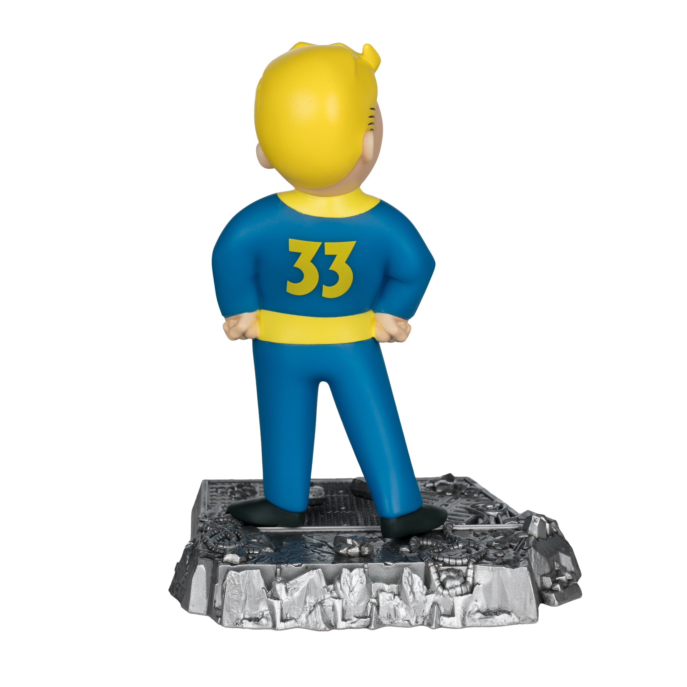 Eine Figur von Vault Boy 33, von hinten. Er trägt einen blauen Overall, gelbes Haar und steht auf einem metallischen Sockel.