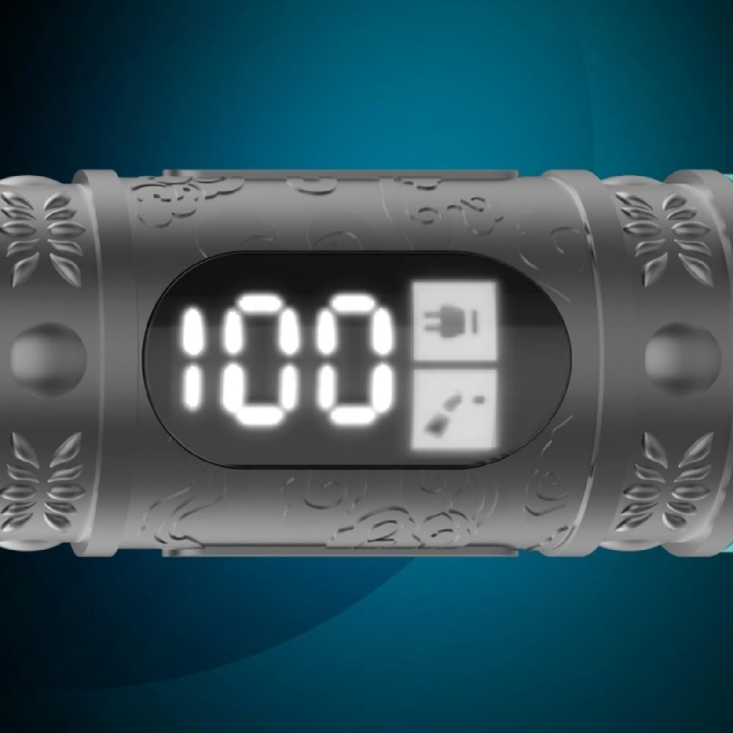 Una vista ravvicinata mostra un dispositivo con un display digitale che indica '100'. Il dispositivo ha motivi decorativi e sfondo blu.