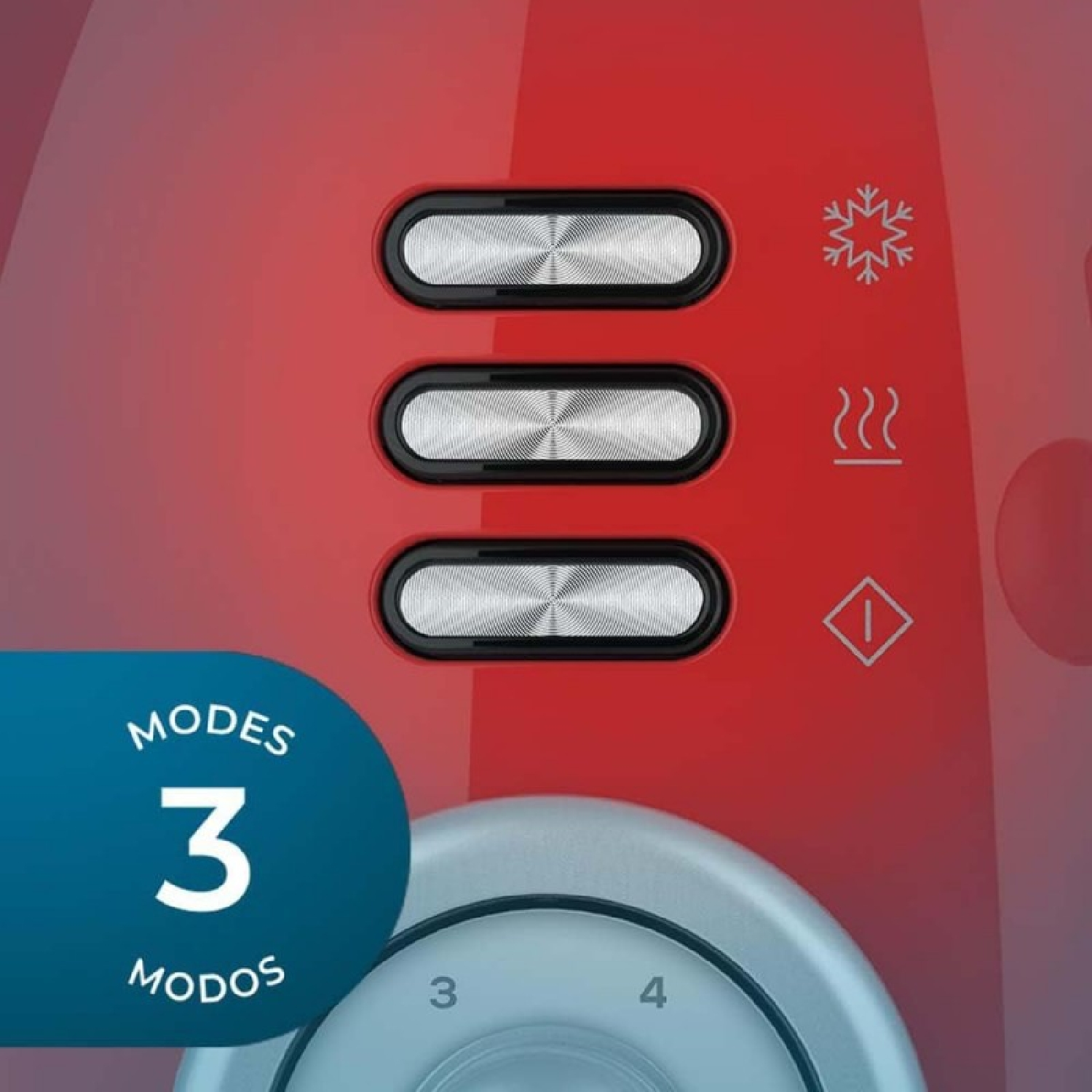 Electrodoméstico rojo con tres botones plateados, un copo de nieve y símbolos de calor. Un dial muestra números y una etiqueta azul dice 'MODOS 3 MODOS'.