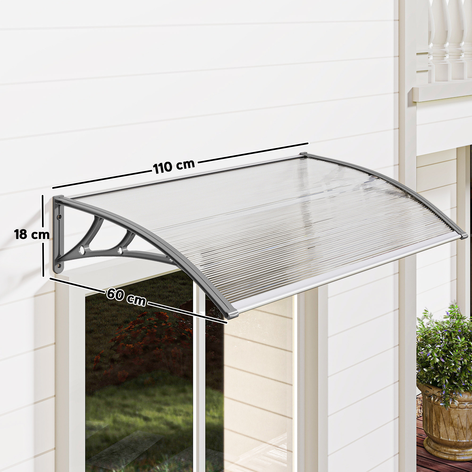 Un toldo transparente está montado sobre una ventana. Las dimensiones son: 110 cm de ancho, 60 cm de profundidad y 18 cm de alto.