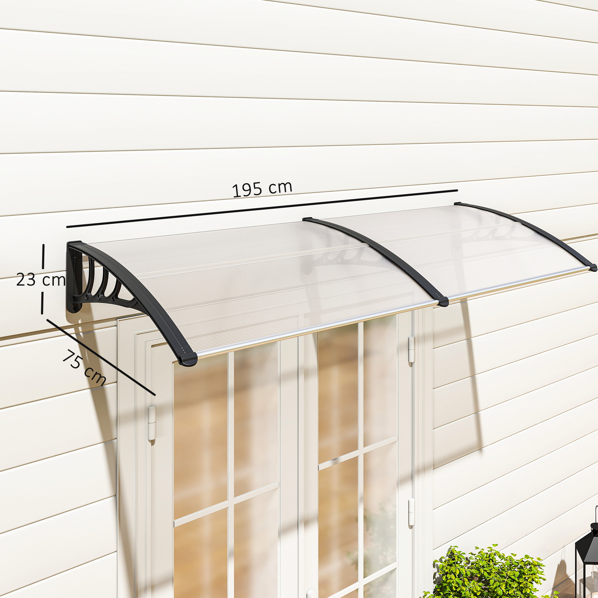 Un toldo transparente está montado sobre puertas dobles blancas. El toldo es negro y mide 195 cm. La pared es blanca con líneas horizontales.